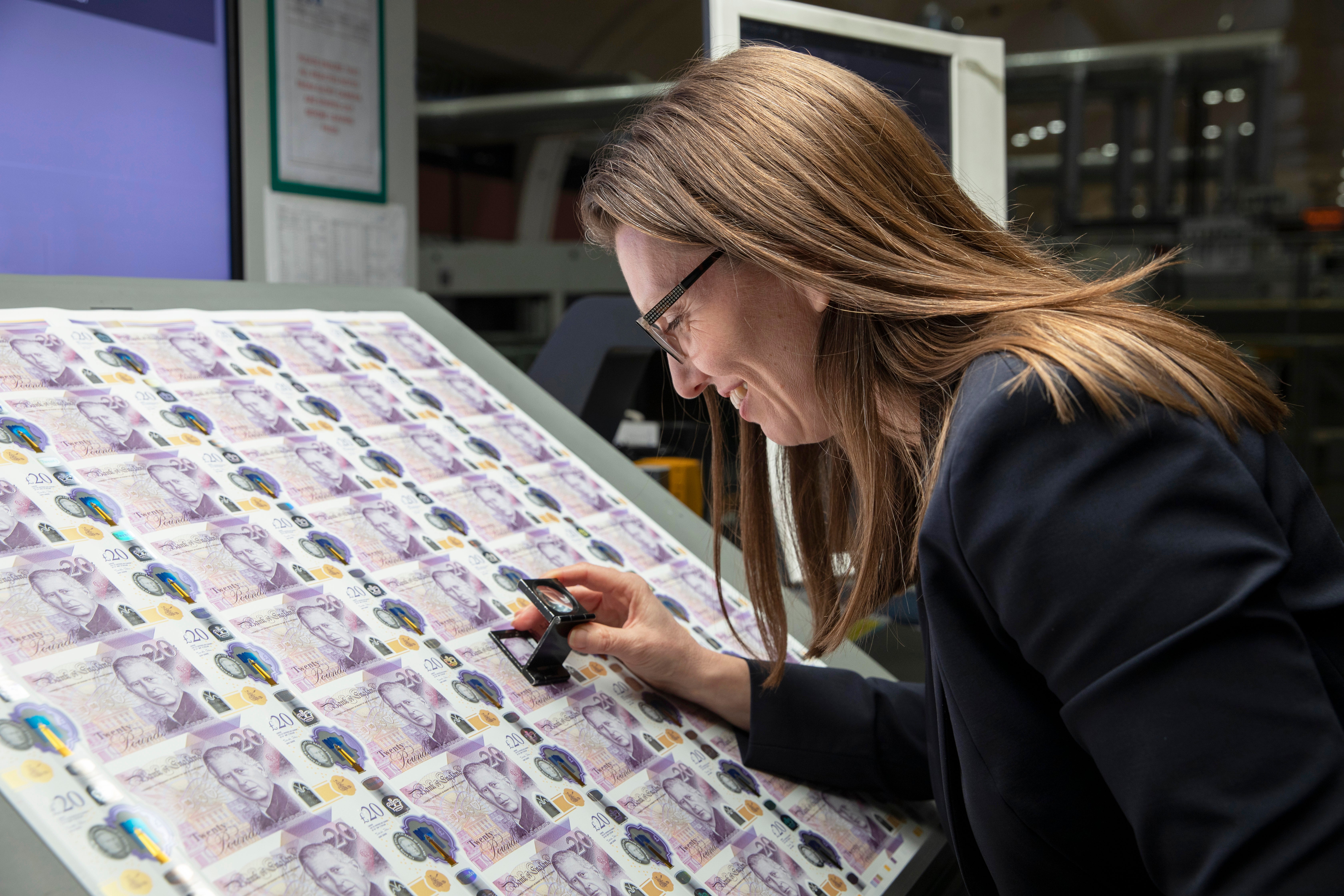 Sarah John, Chief Cashier, with the new King Charles III £20 note