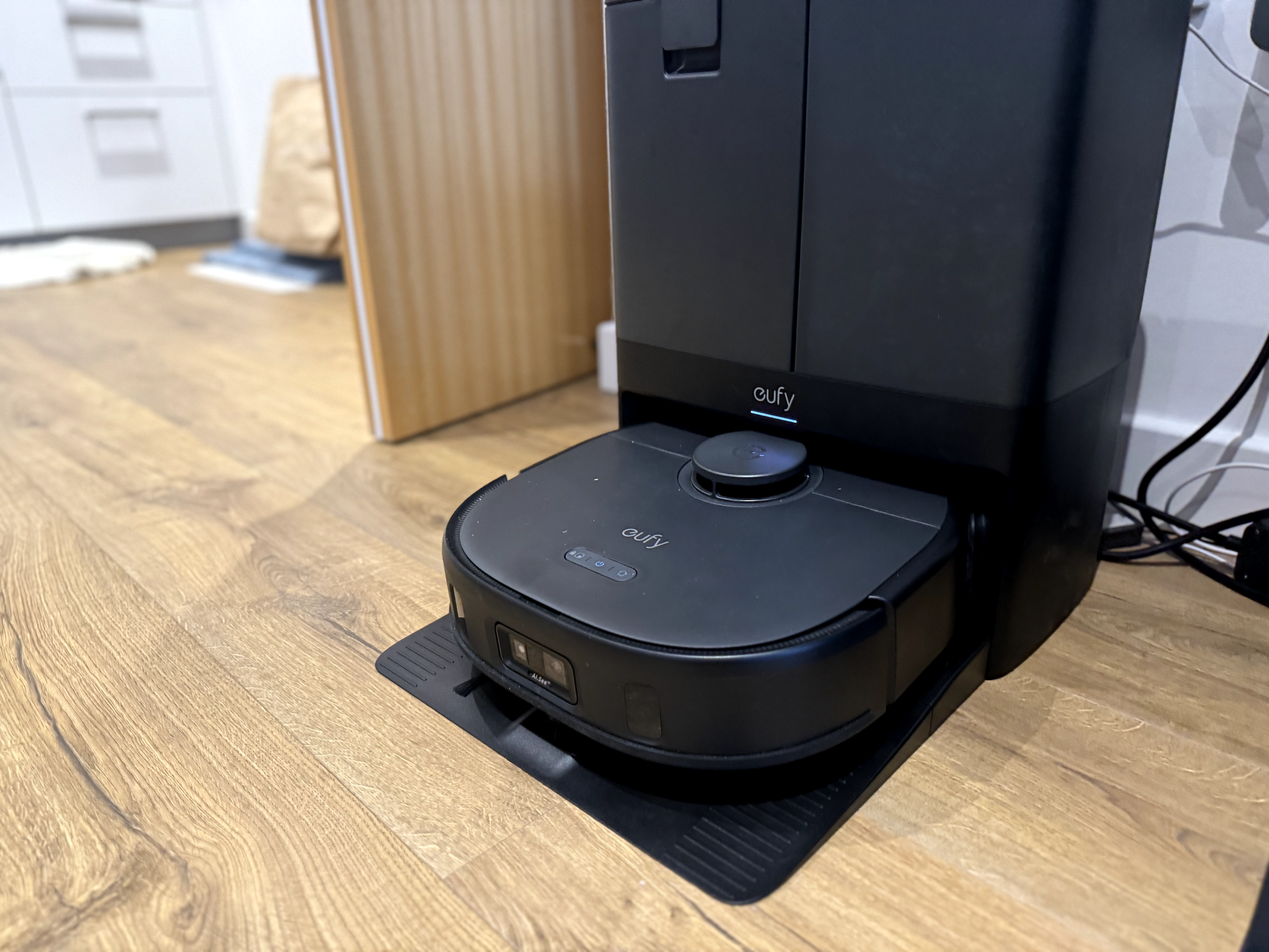 The Eufy X10 pro omni robot vacuum cleaner in its omni station