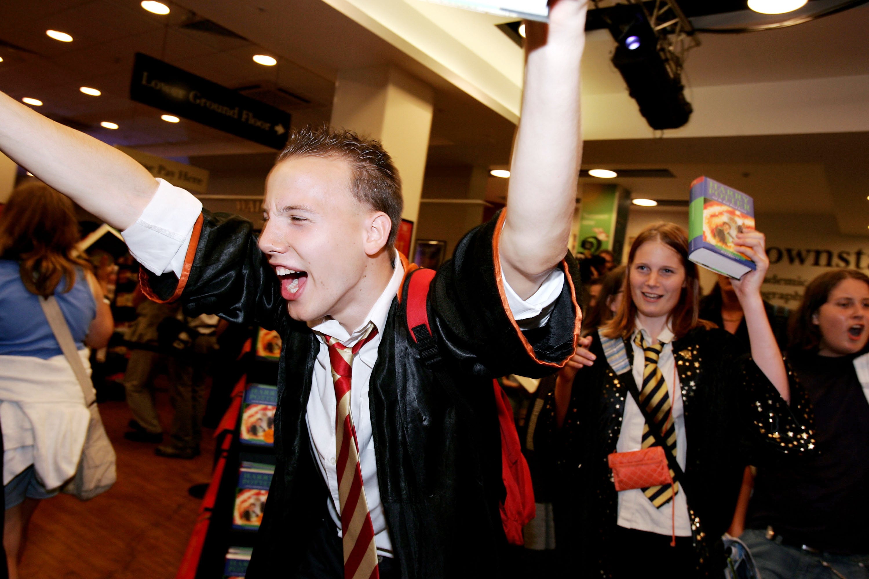 A euphoric fan gets a copy of the penultimate Harry Potter book at a midnight launch at Waterstone’s Oxford Street in 2005