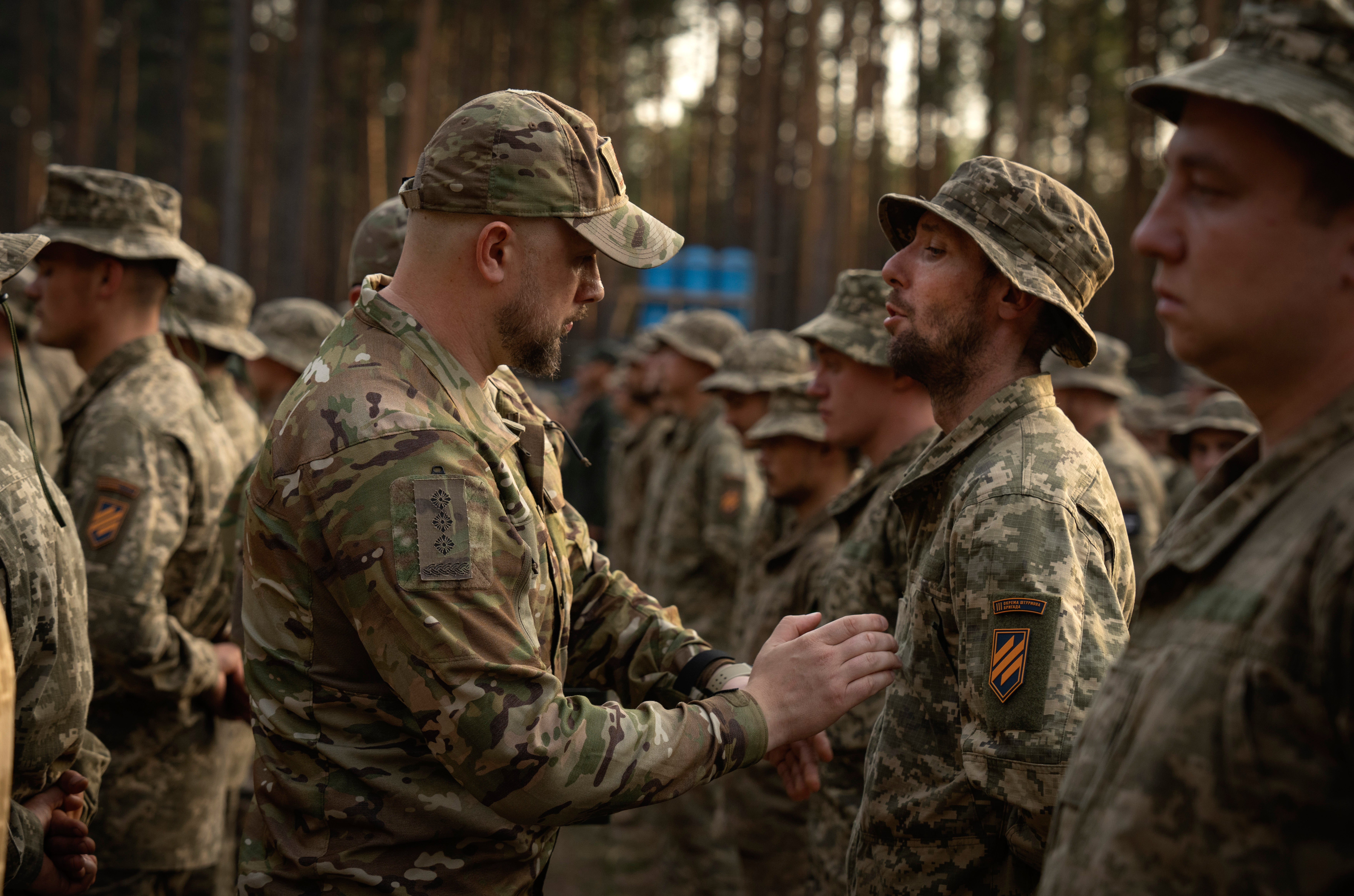 Newly recruited soldiers who mark the end of their training at a military base close to Kyiv, Ukraine