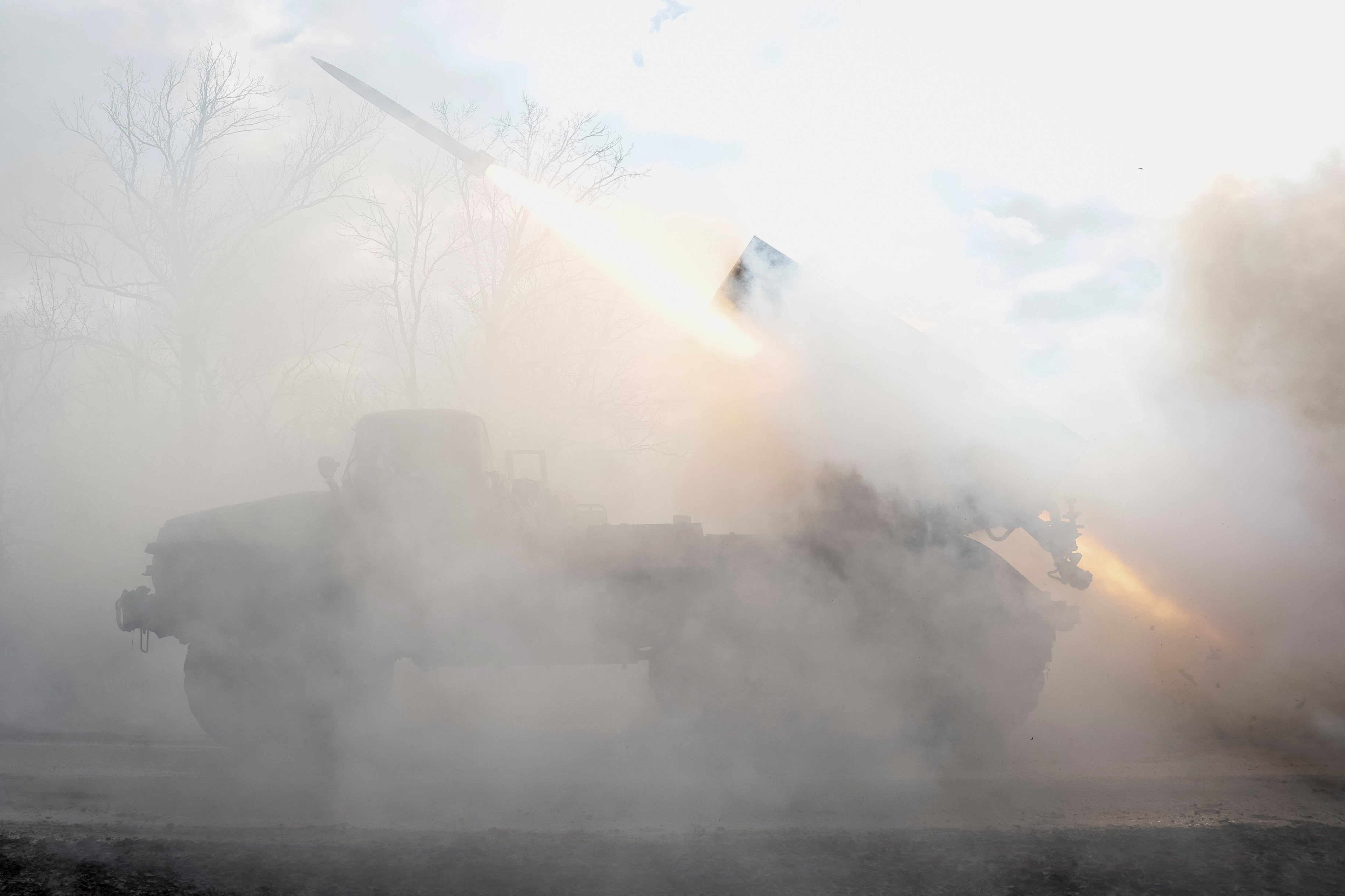 Servicemen of the 59th Separate Motorised Infantry Brigade fire a BM-21 Grad multiple launch rocket system towards Russian troops in Donetsk