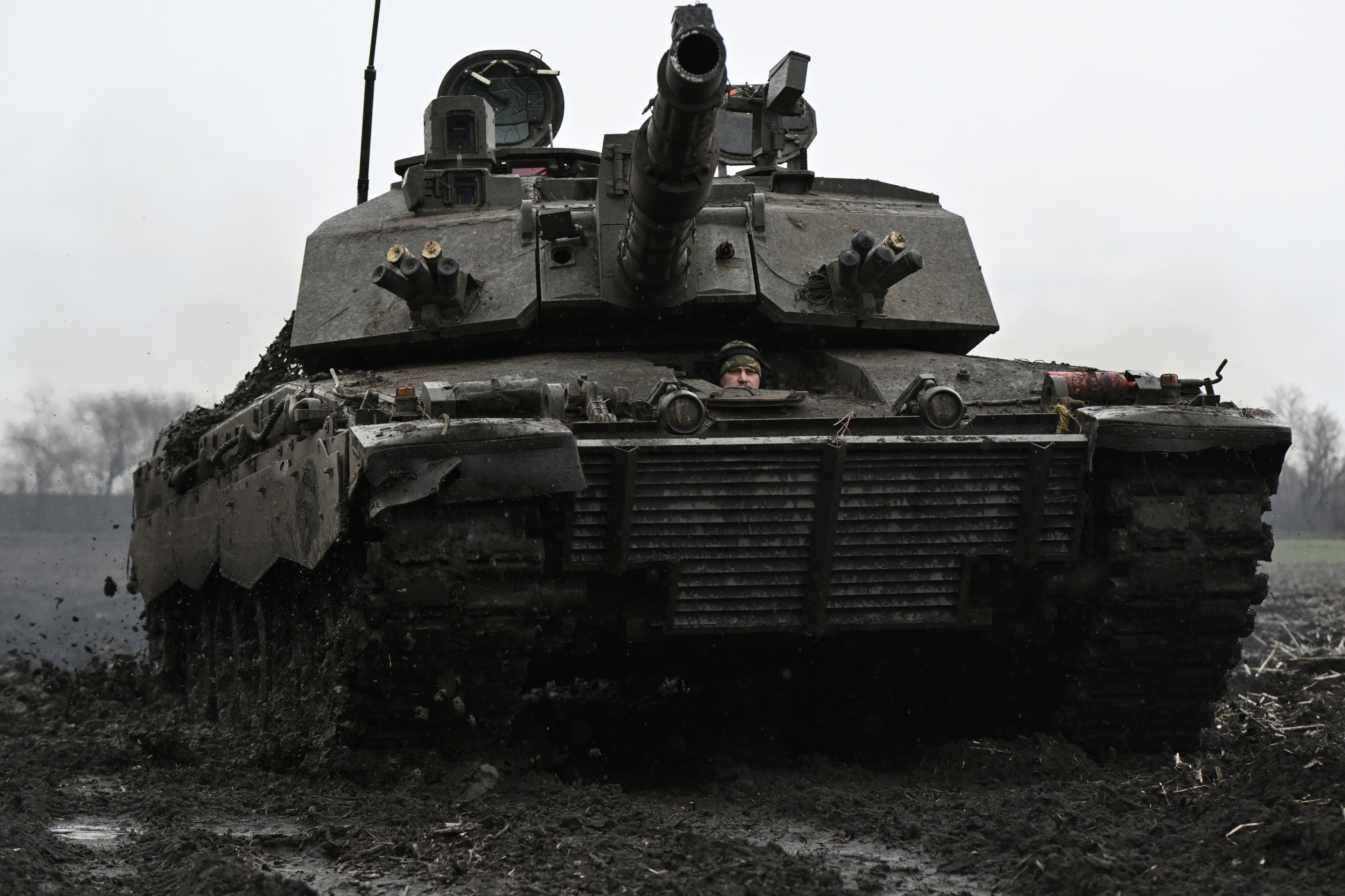 A Ukrainian serviceman of the 82nd Separate Air Assault Brigade in a Challenger 2 tank near the front line in Zaporizhzhia