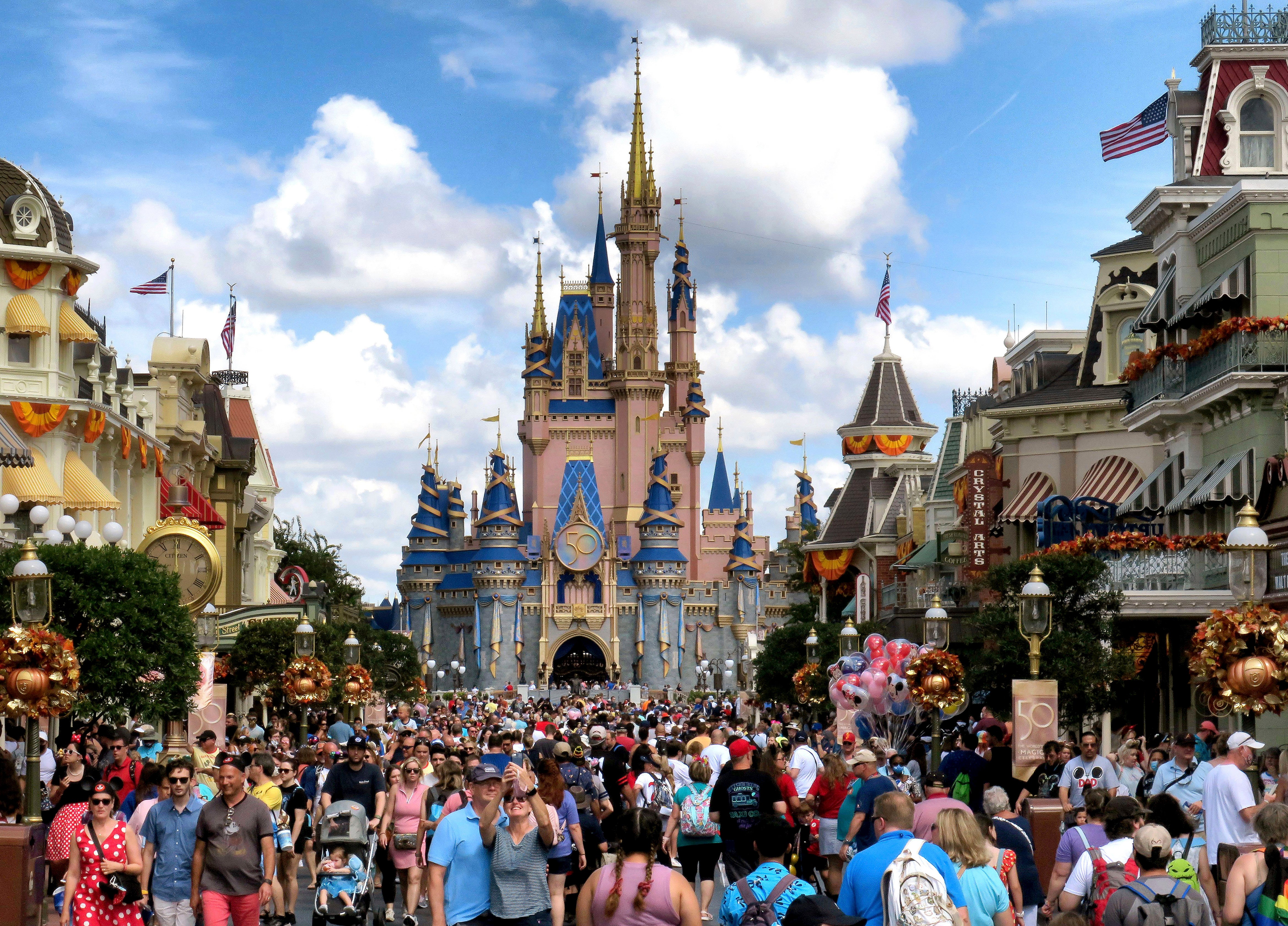 Crowds fill Main Street USA in front of Cinderella Castle at the Magic Kingdom on the 50th anniversary of Walt Disney World in Lake Buena Vista