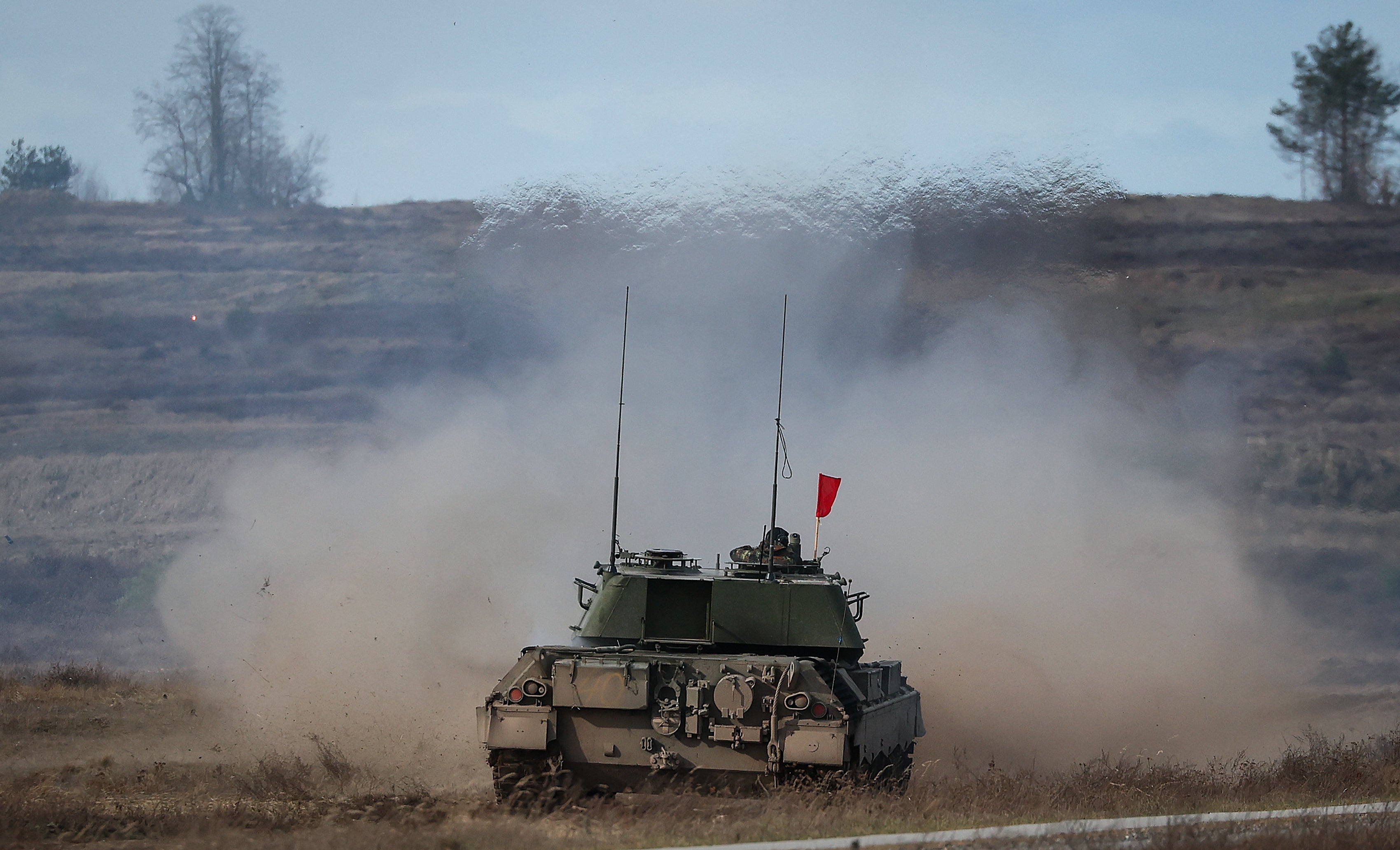 A "Leopard 1 A5" combat tank of the German armed forces Bundeswehr fires during a live military exercise during a visit of Ukrainian troop