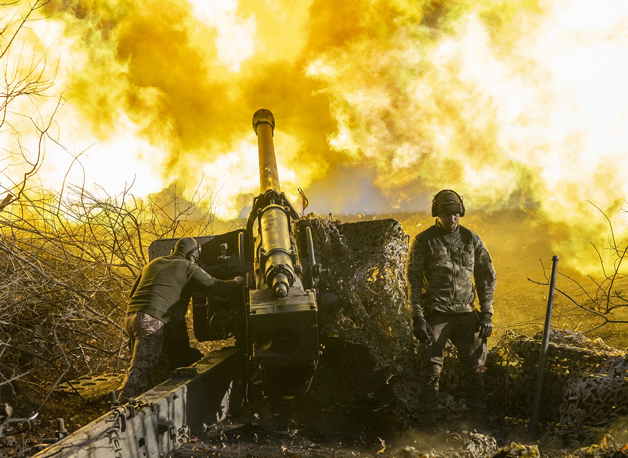 A Ukrainian soldier from an artillery unit fires towards Russian positions outside Bakhmut