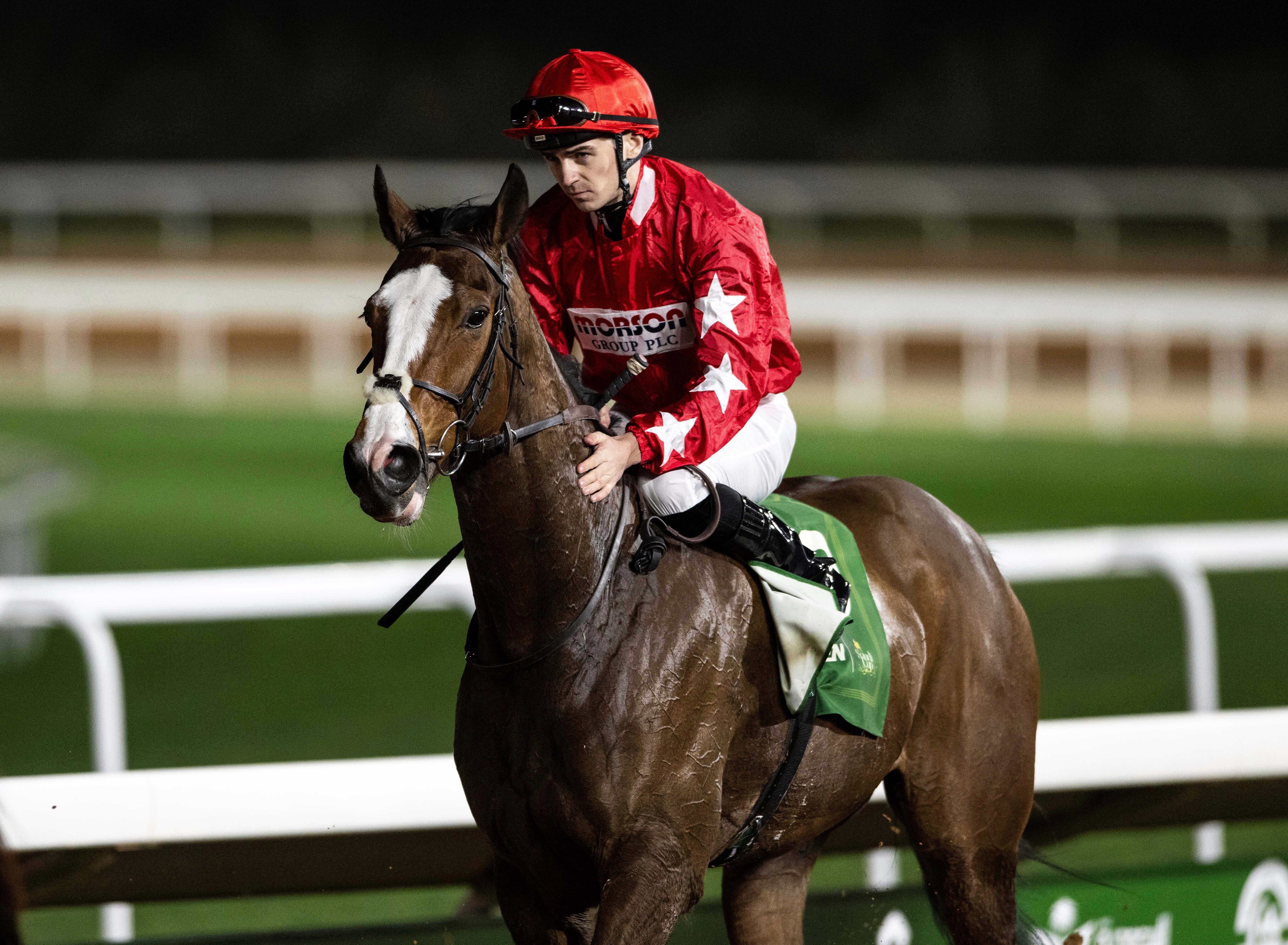 Jockey Oisin Orr pats Spirit Dancer after winning G2 Howden Neom Turf Cup over 2100m at the King Abdulaziz racetrack in Riyadh, Saudi Arabia