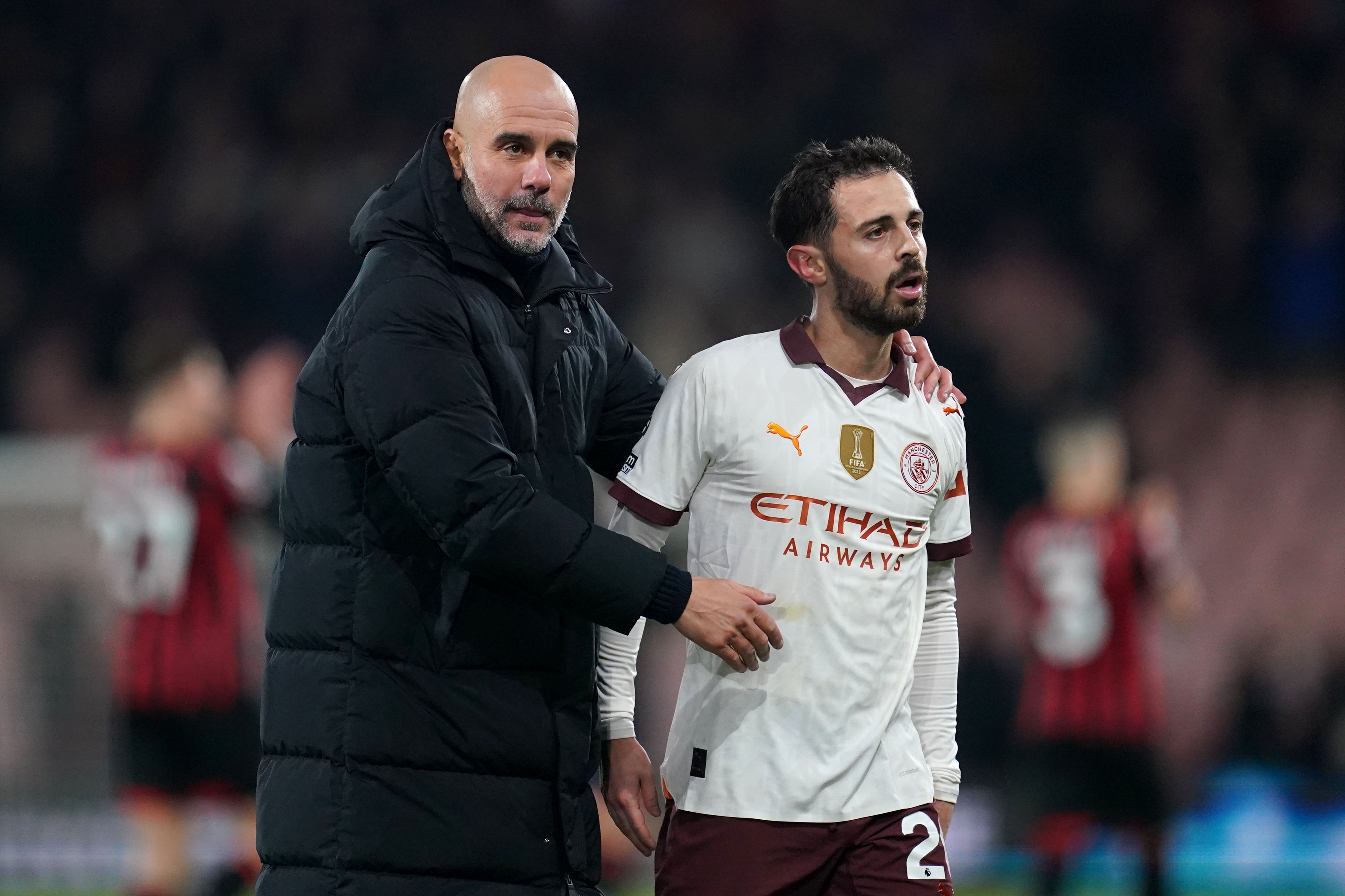 Pep Guardiola (left) watched Manchester City edge out Bournemouth by a 1-0 score (Adam Davy/PA)