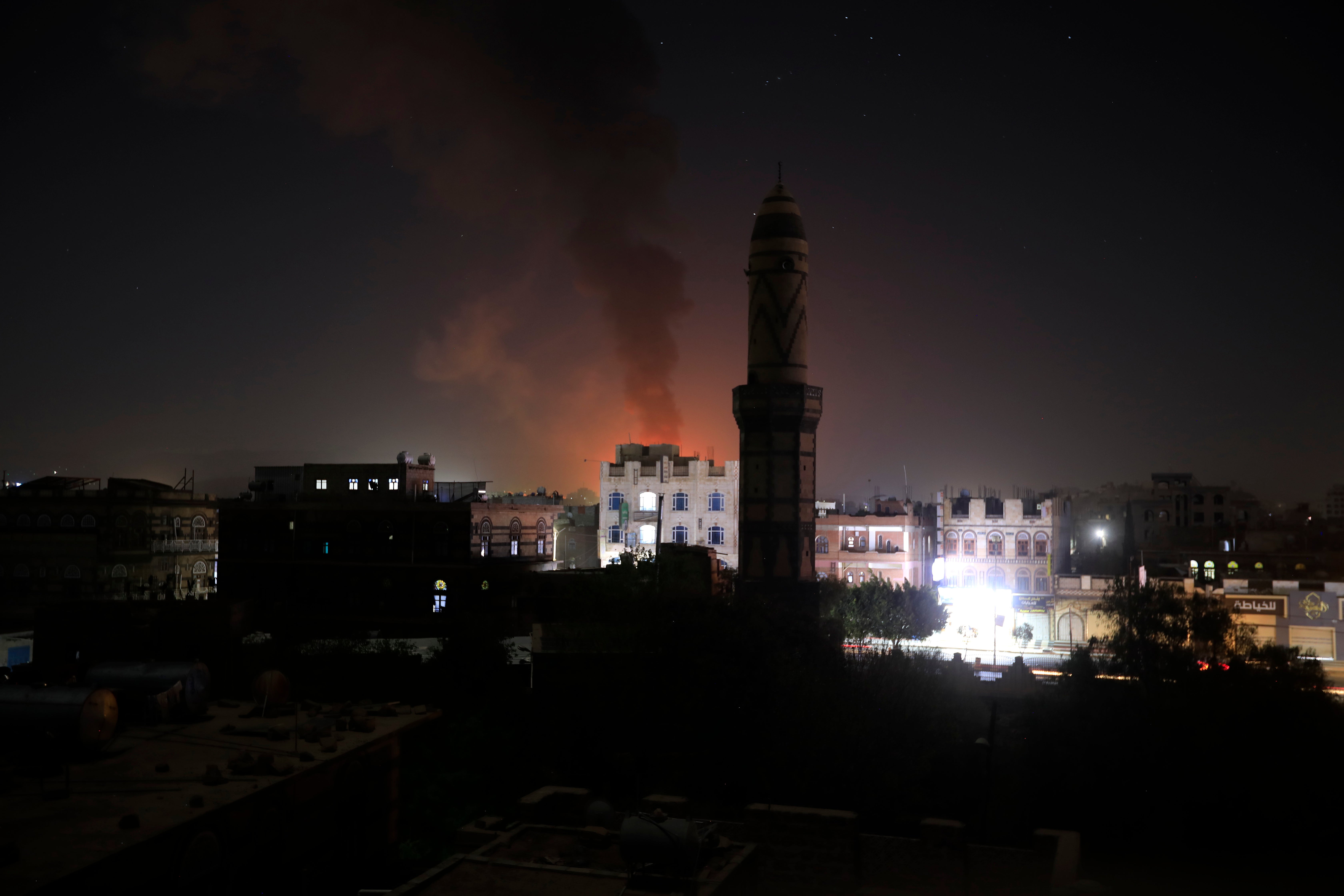 Smokes rise from a Houthi position following US and UK strikes in Sana'a, Yemen