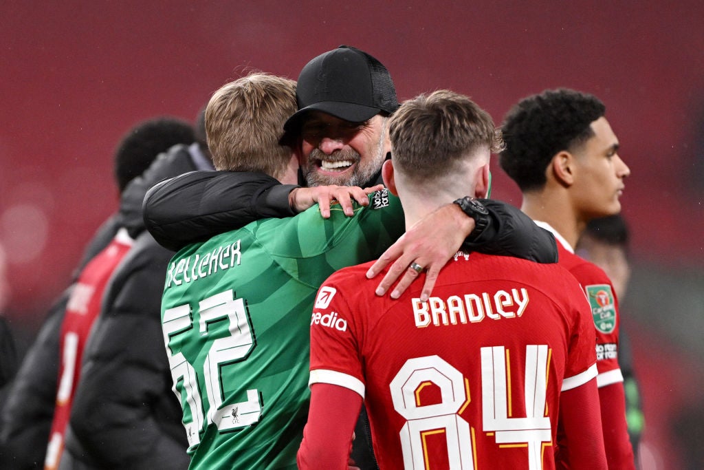 Klopp hugs two starting Academy graduates, Caoimhin Kelleher and Conor Bradley