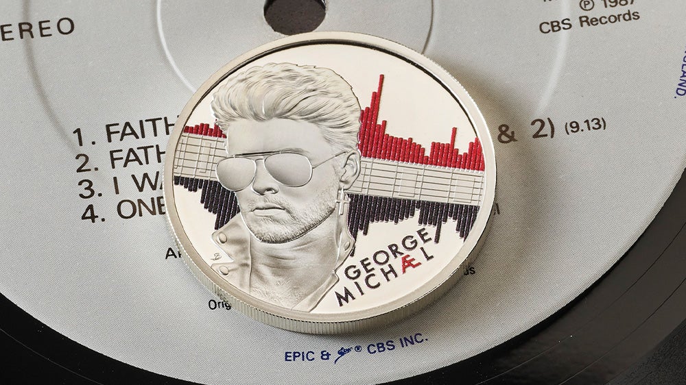 A close-up of the red and black design for the George Michael collector’s coin