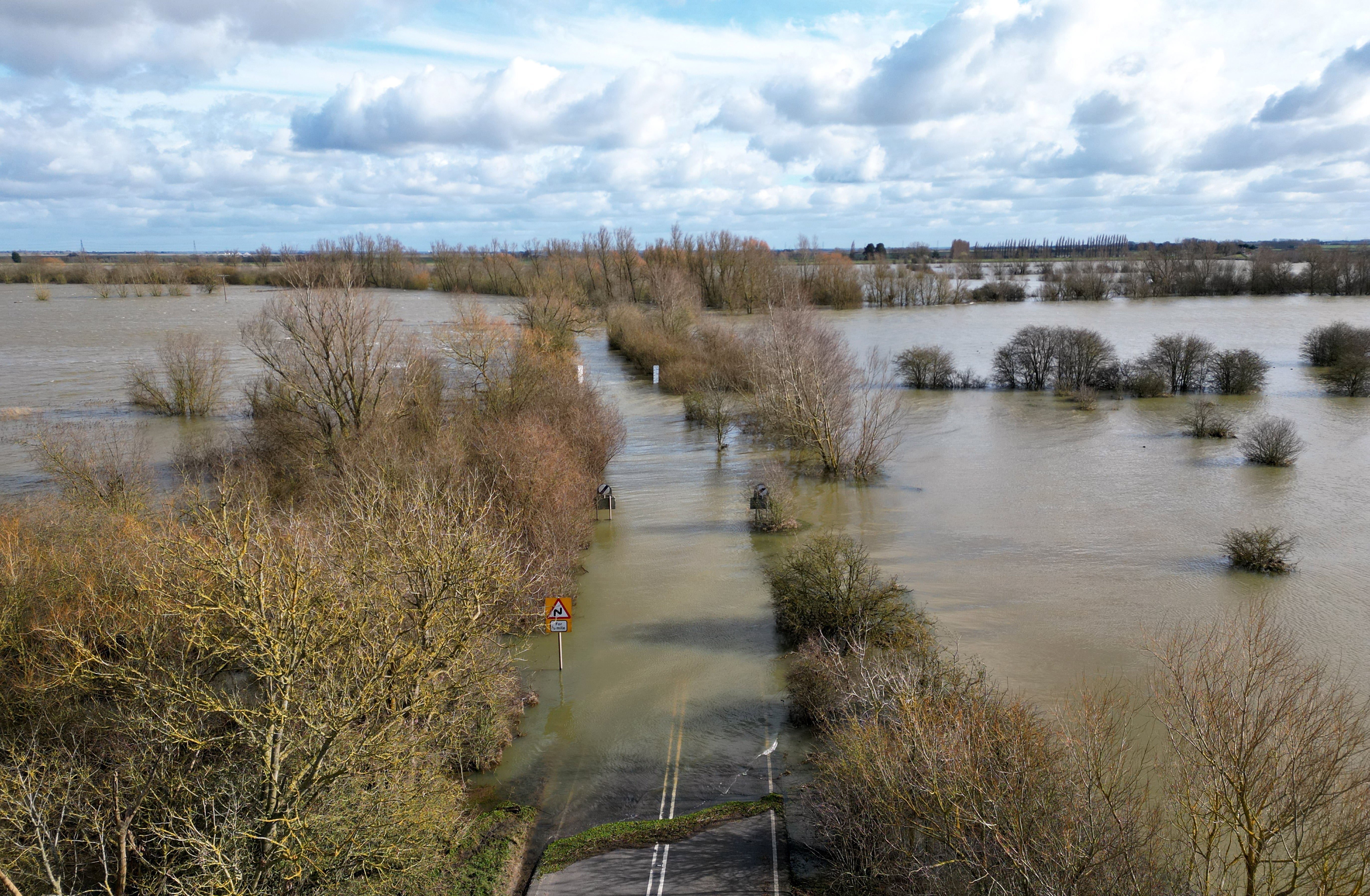 A flood A-road in Welney, Norfolk, as the region faced its warmest and wettest February on record