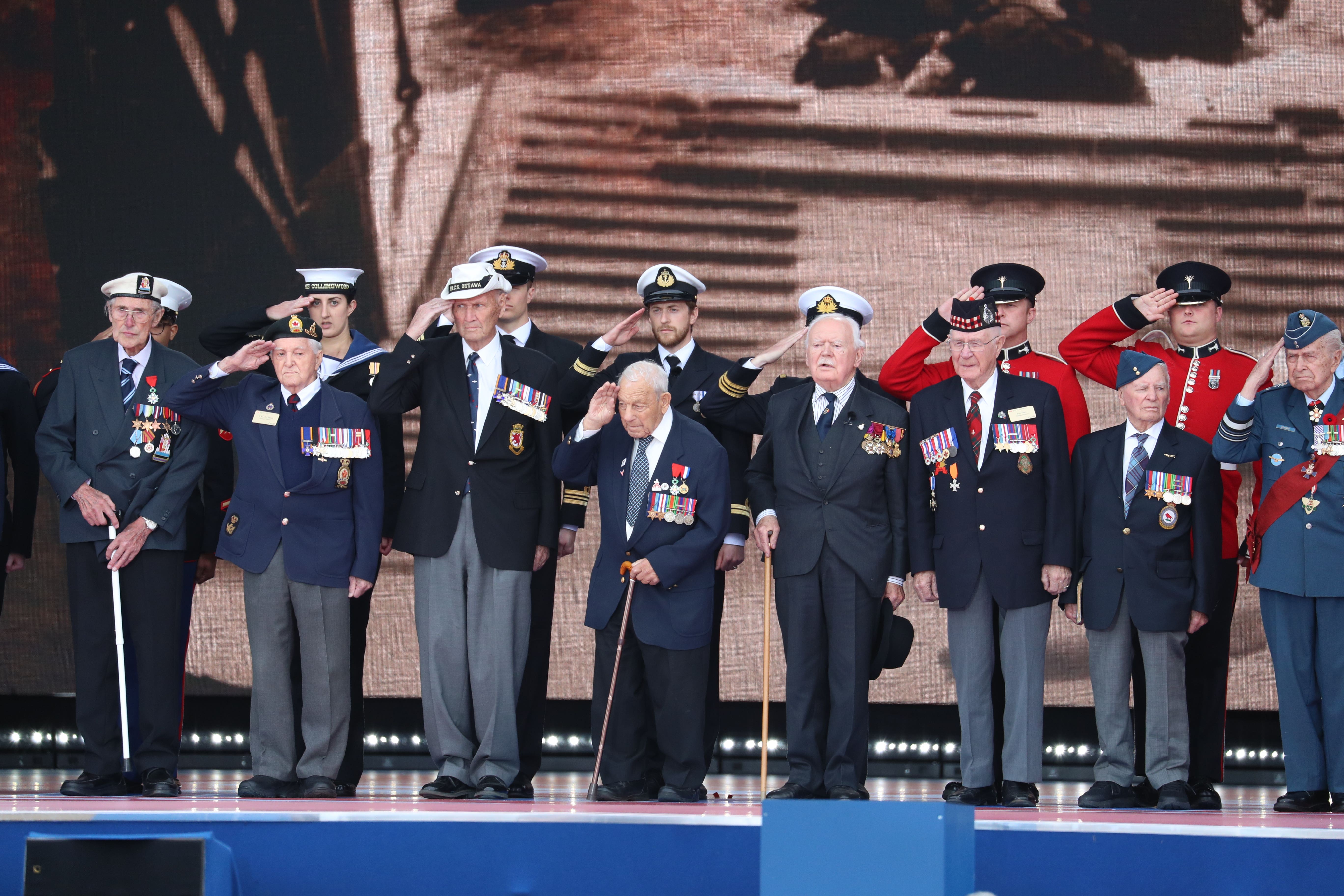 D-Day veterans take the stage during the commemorations for the 75th Anniversary of the D-Day landings at Southsea Common in Portsmouth.