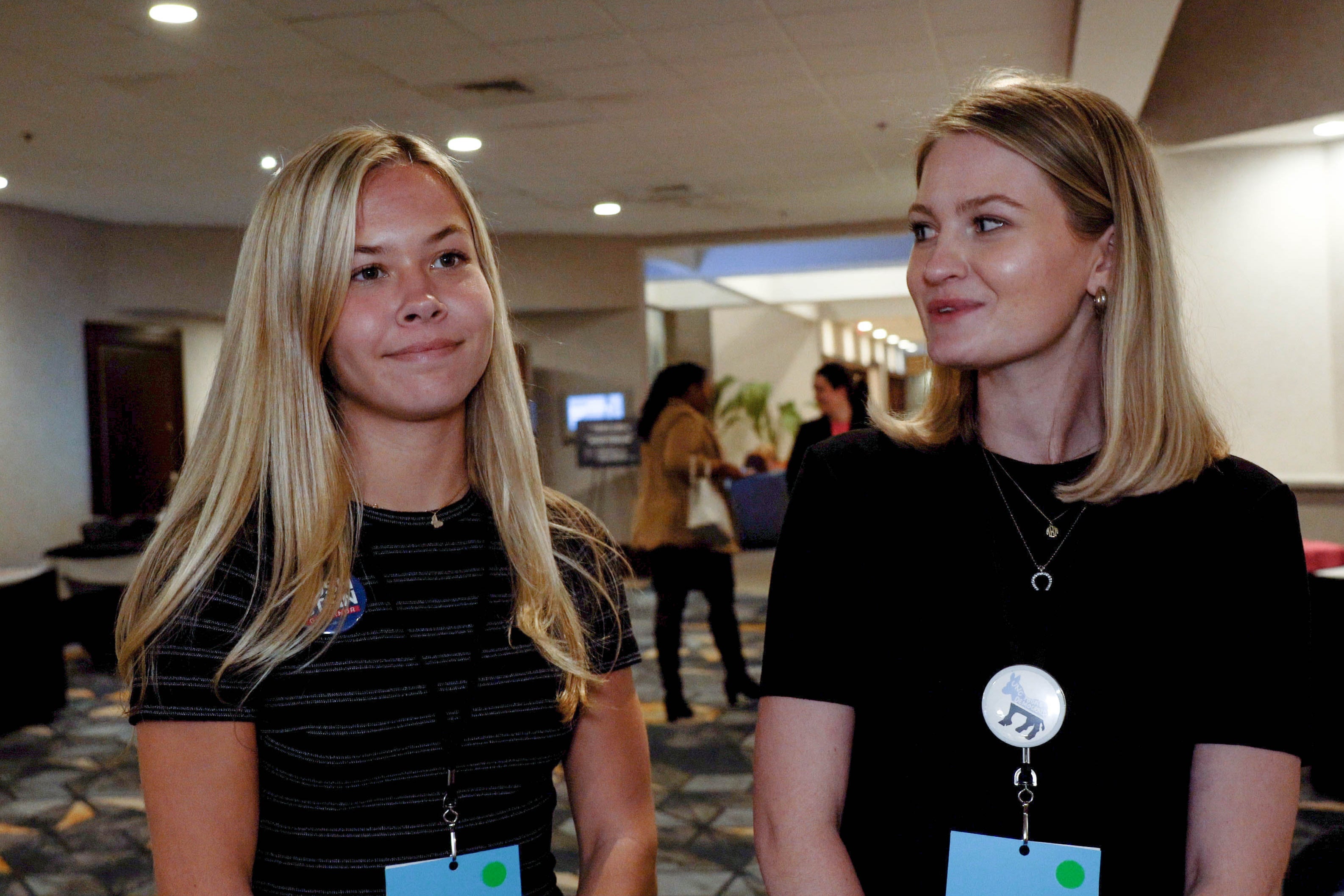 Sloan Duvall (left) and Mary Margaret Barbee (right) discuss the 2024 election at the Young Democrats of North Carolina convention