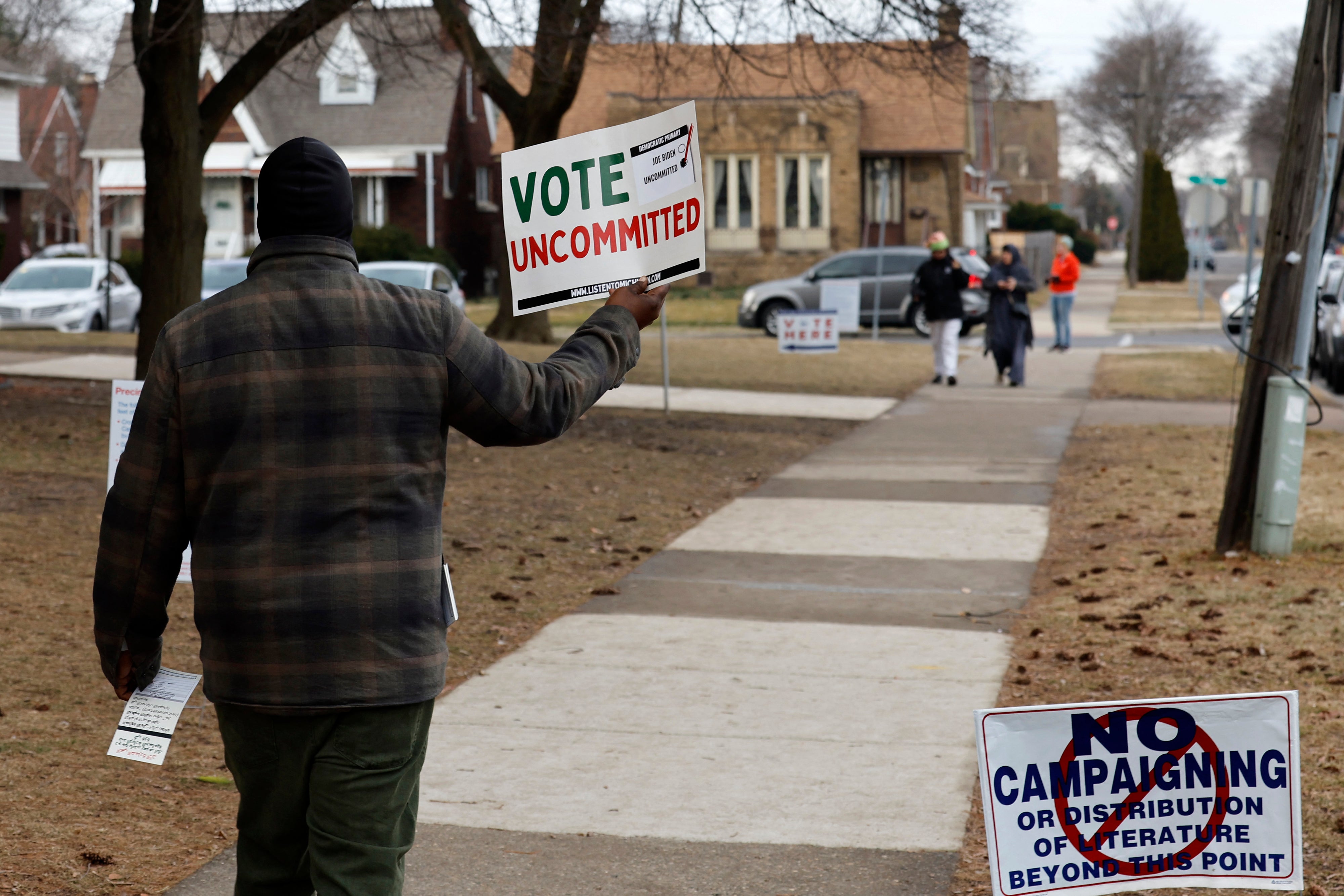 A volunteer asks voters to cast an uncommitted ballot in Dearborn, Michigan, over President Biden’s backing of Israel. February 2024