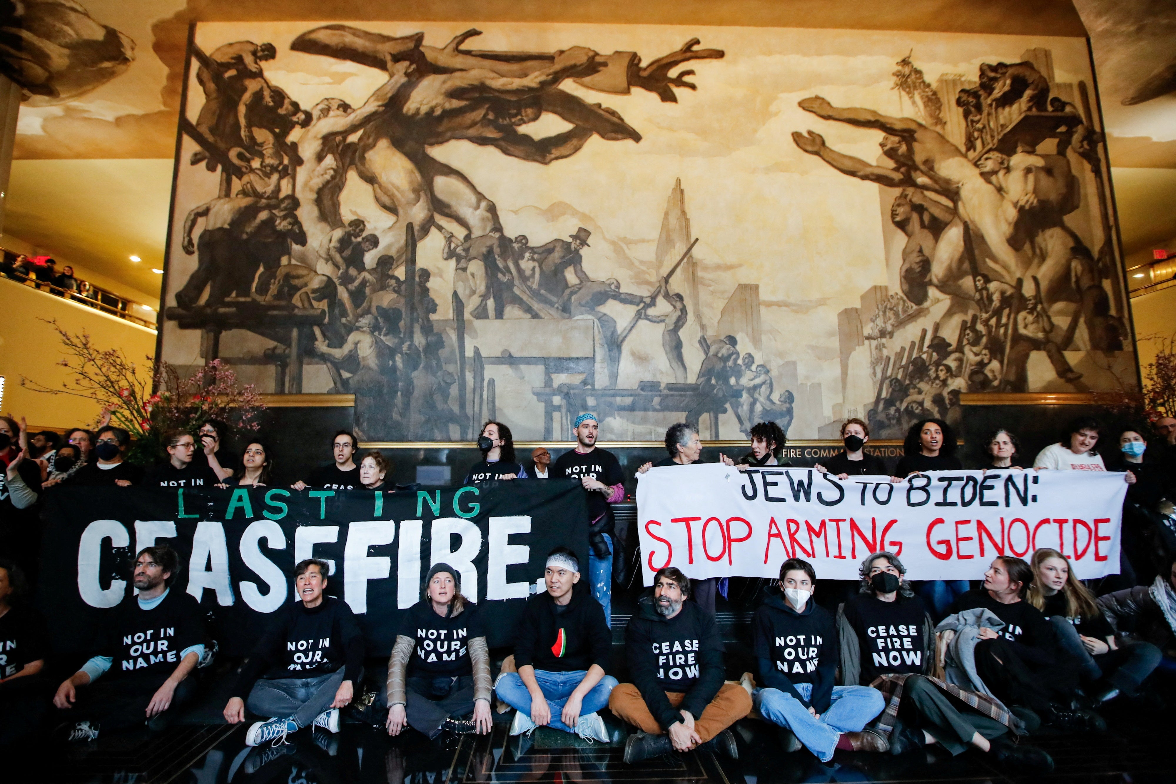 Demonstrators protest inside the Rockefeller Center asking for a ceasefire in the ongoing conflict between Israel and the Palestinian Islamist group Hamas