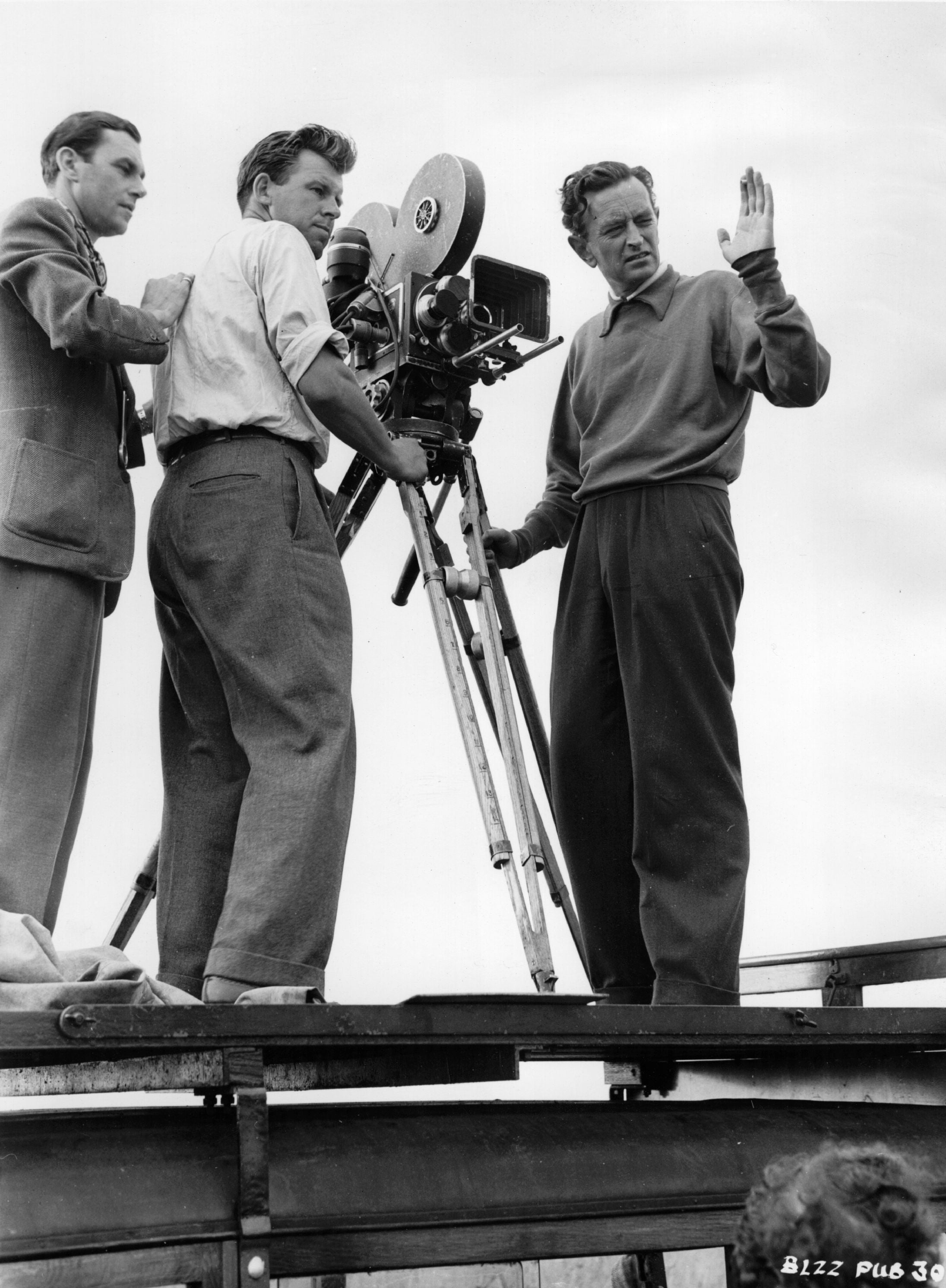 David Lean consults Jack Hildyard, the cinematographer, and John Godar, the camera operator, during filming of ‘Sound Barrier’