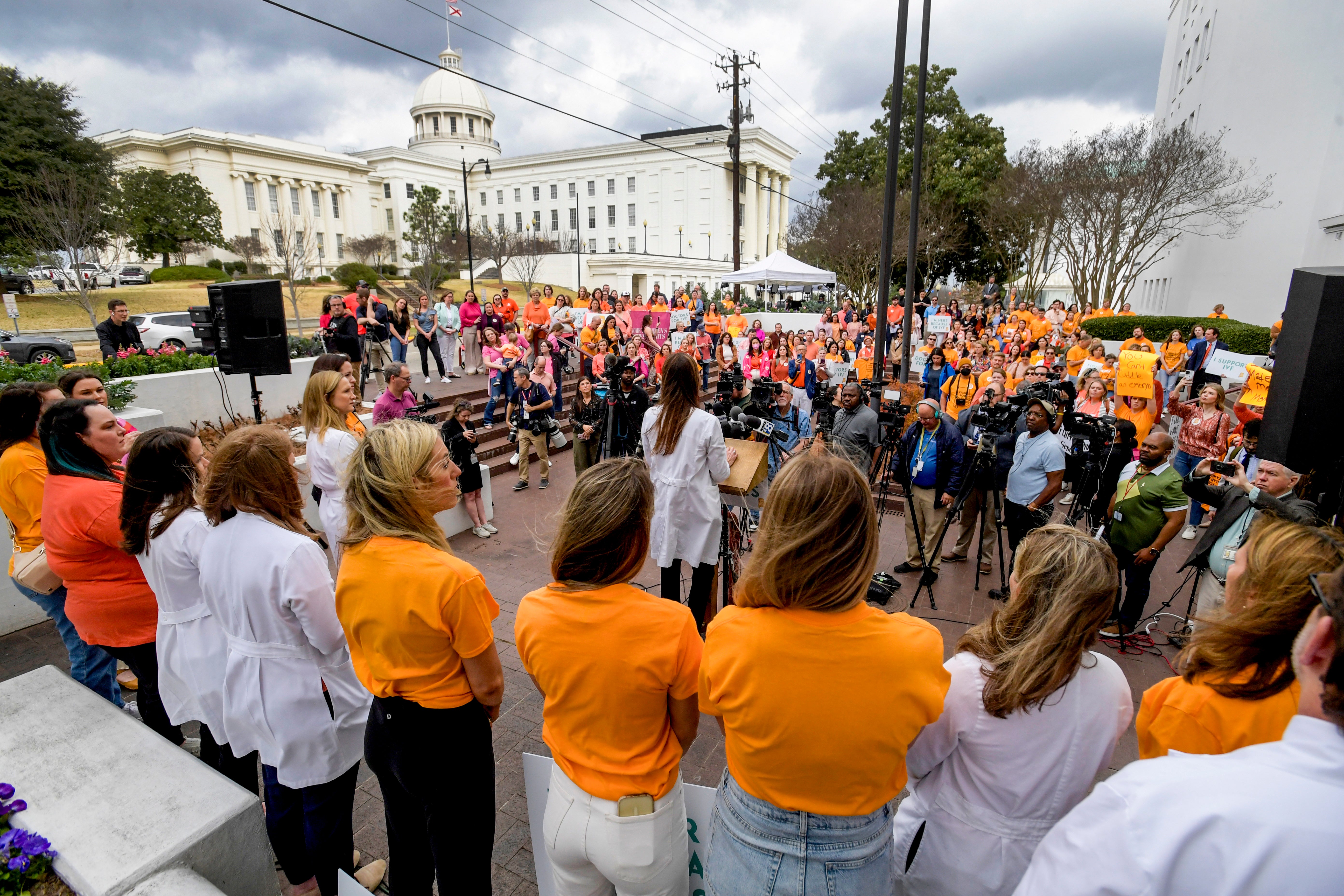 Hundreds of women rally outside the Alabama State House on Wednesday in support of legislation to protect IVF treatment