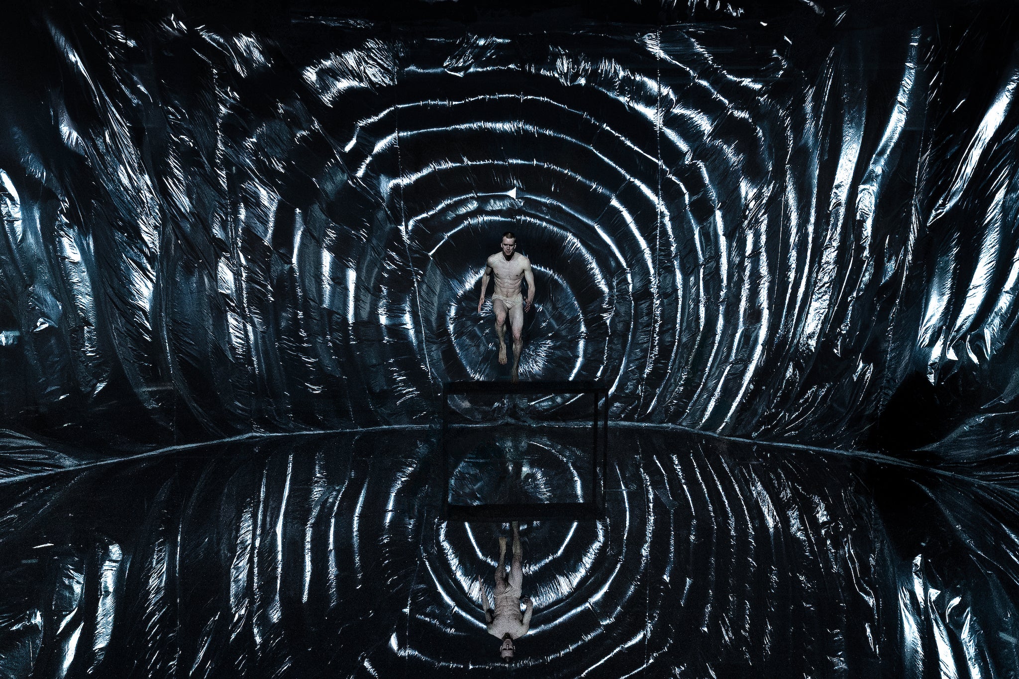 Ripple in reflection: plastic sheeting gives the set of ‘Ink’ an otherworldly gravitas