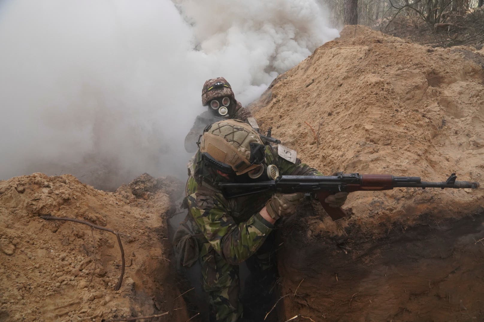 Ukrainian national guard soldiers simulate assault operations during tactical training at a shooting range in Kharkiv (Andrii Marienko/AP)