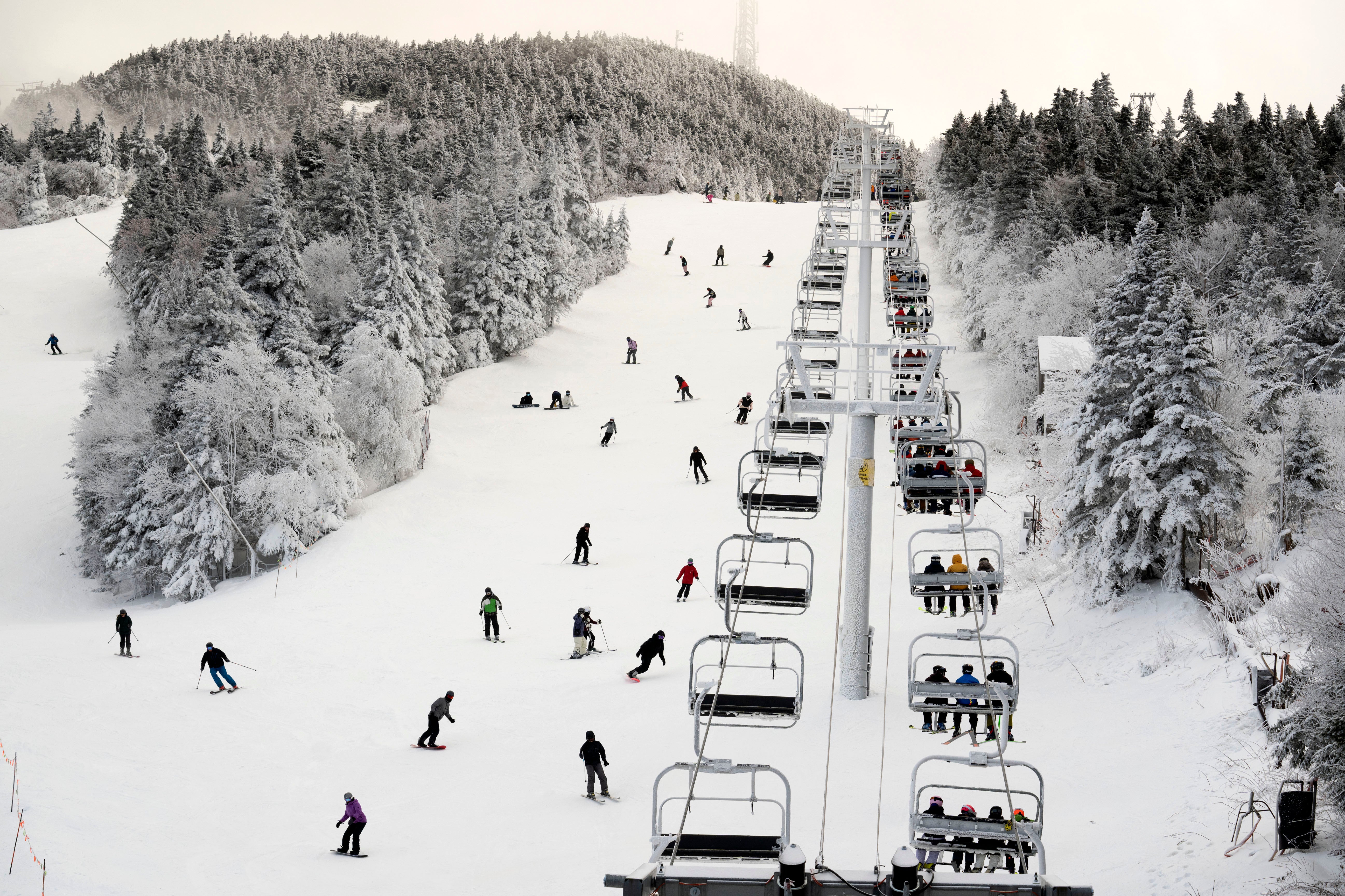 Thanksgiving holiday skiers descend near the North Ridge Quad chairlift - but for how long?