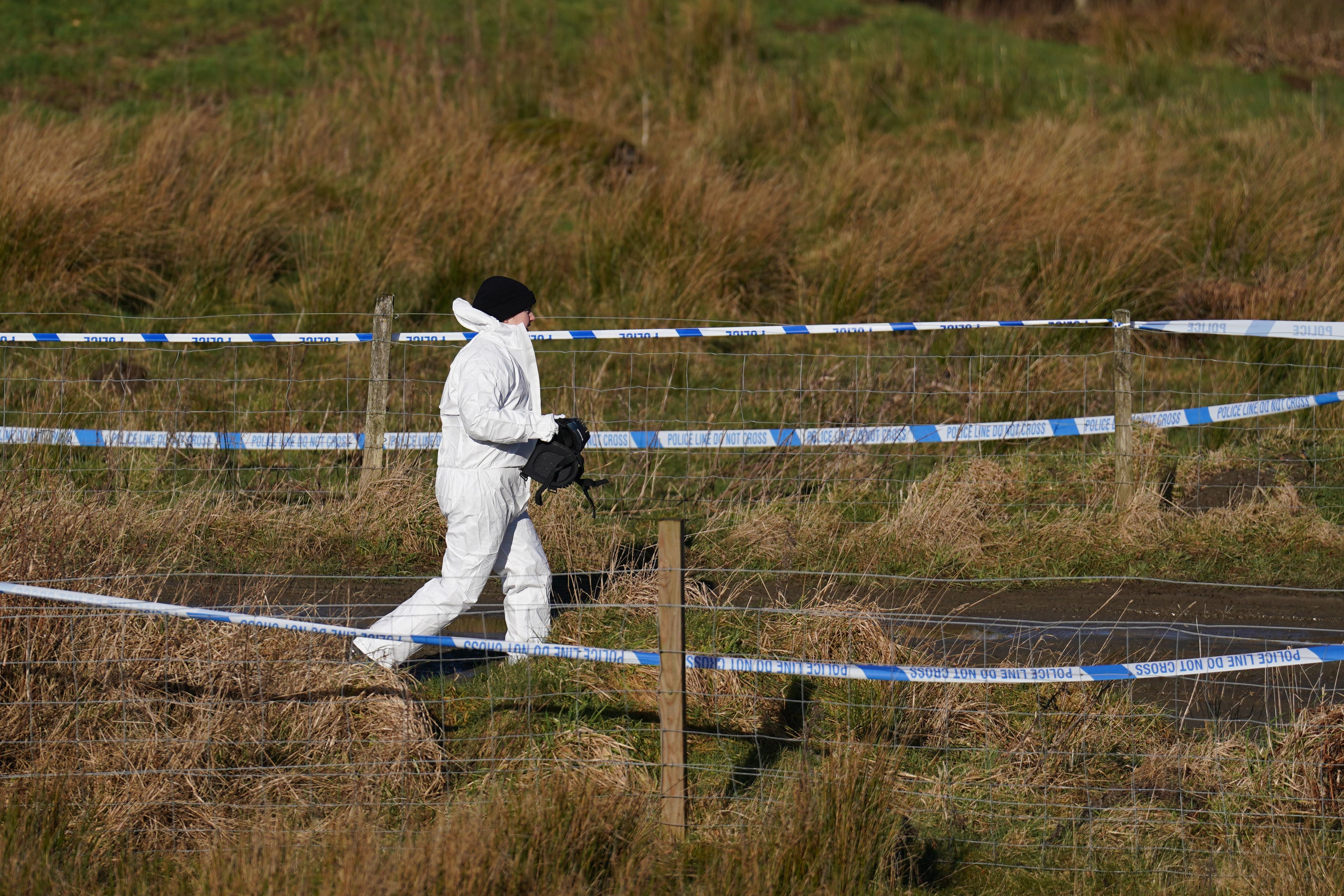 Police at the scene in the Pitilie area on the outskirts of Aberfeldy, Perthshire (Andrew Milligan/PA Wire)