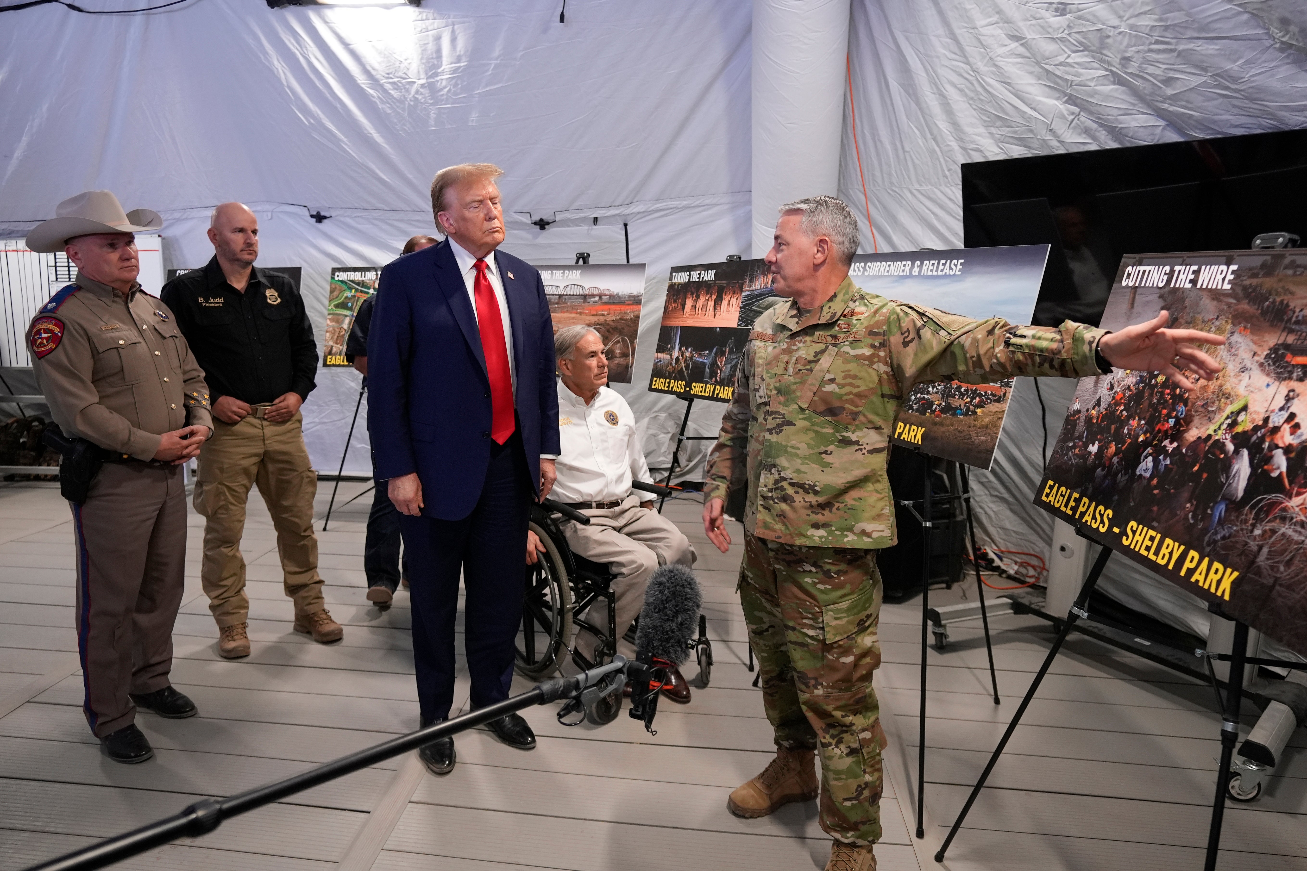 Former President Donald Trump listens to Major Generak Thomas Suelzer, Adjutant General for the State of Texas, during a visit to the US-Mexico border