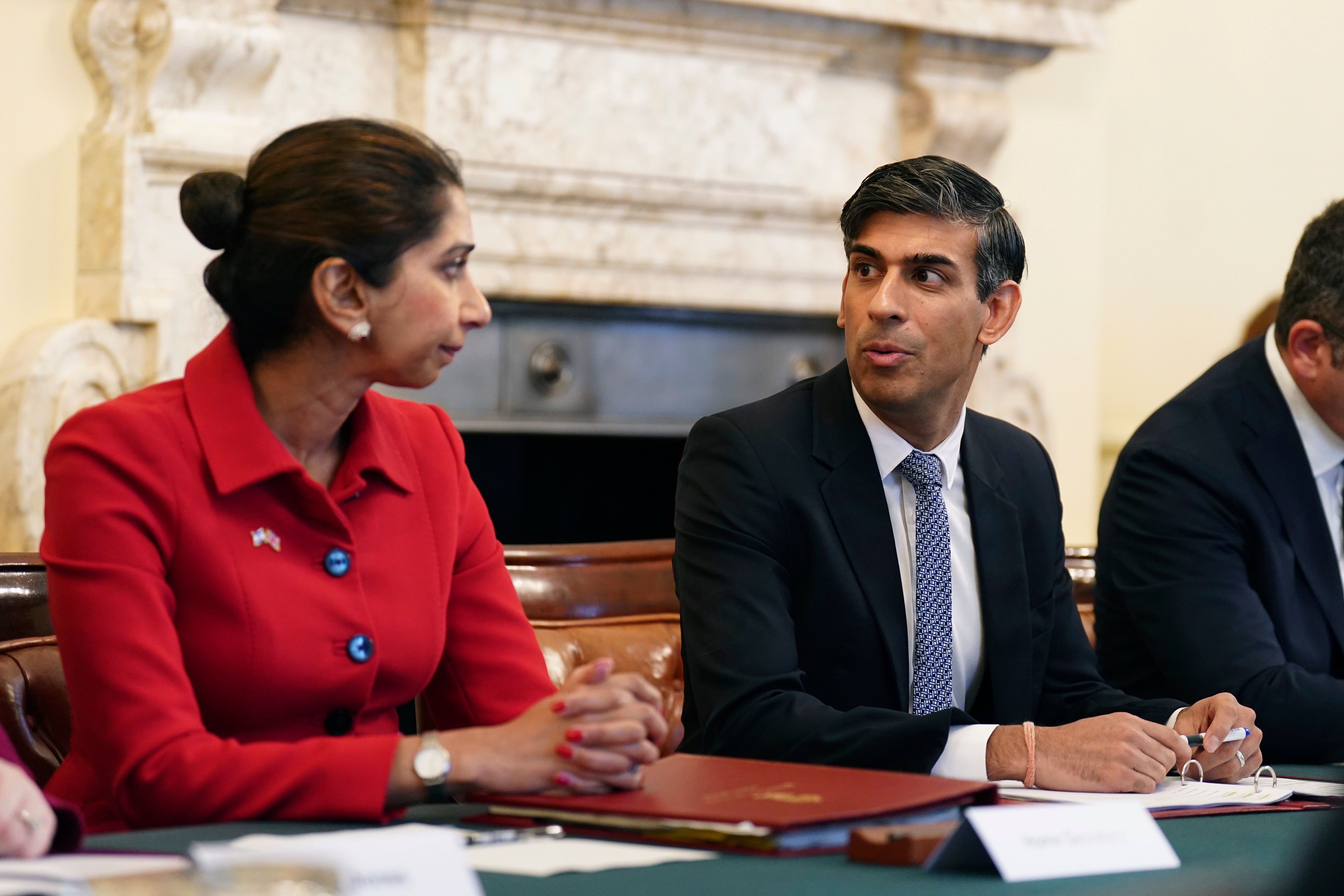 Suella Braverman listens to Rishi Sunak during a meeting