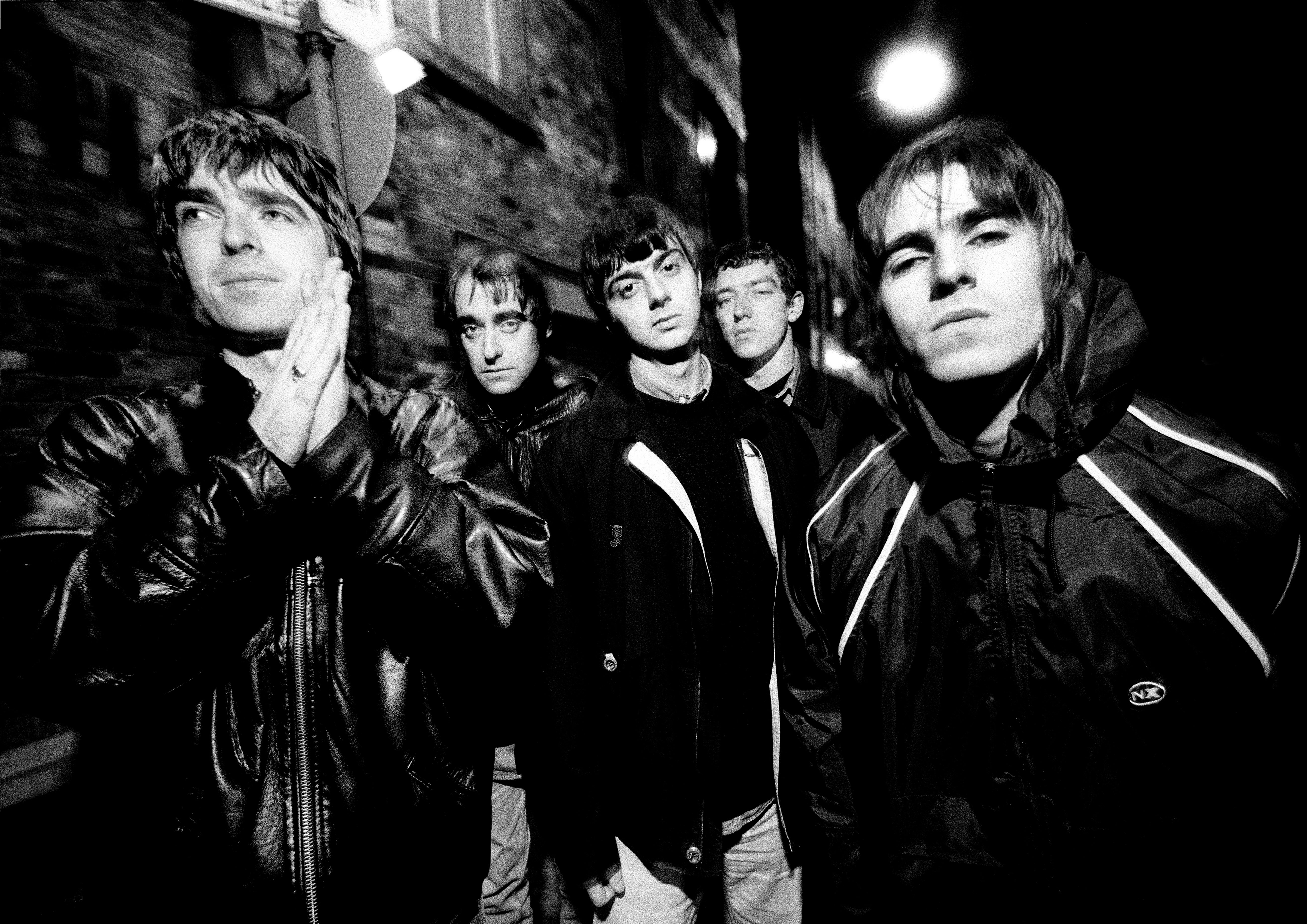 Group portrait of Oasis in Manchester on 29 November 1993. L-R Noel Gallagher, Paul Arthurs (aka Bonehead), Paul McGuigan, Tony McCarroll, Liam Gallagher