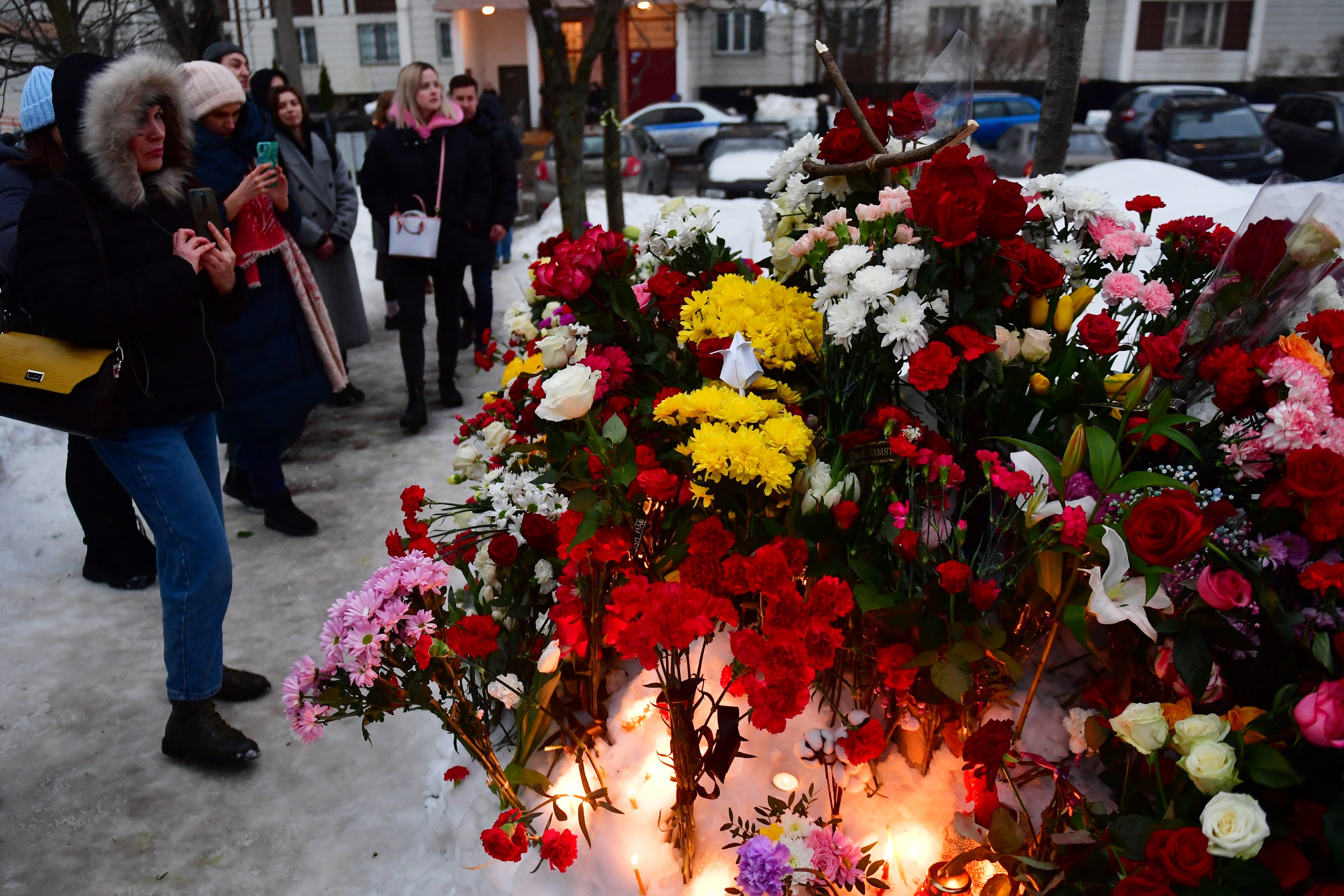 Tributes at a makeshift memorial outside the cemetery