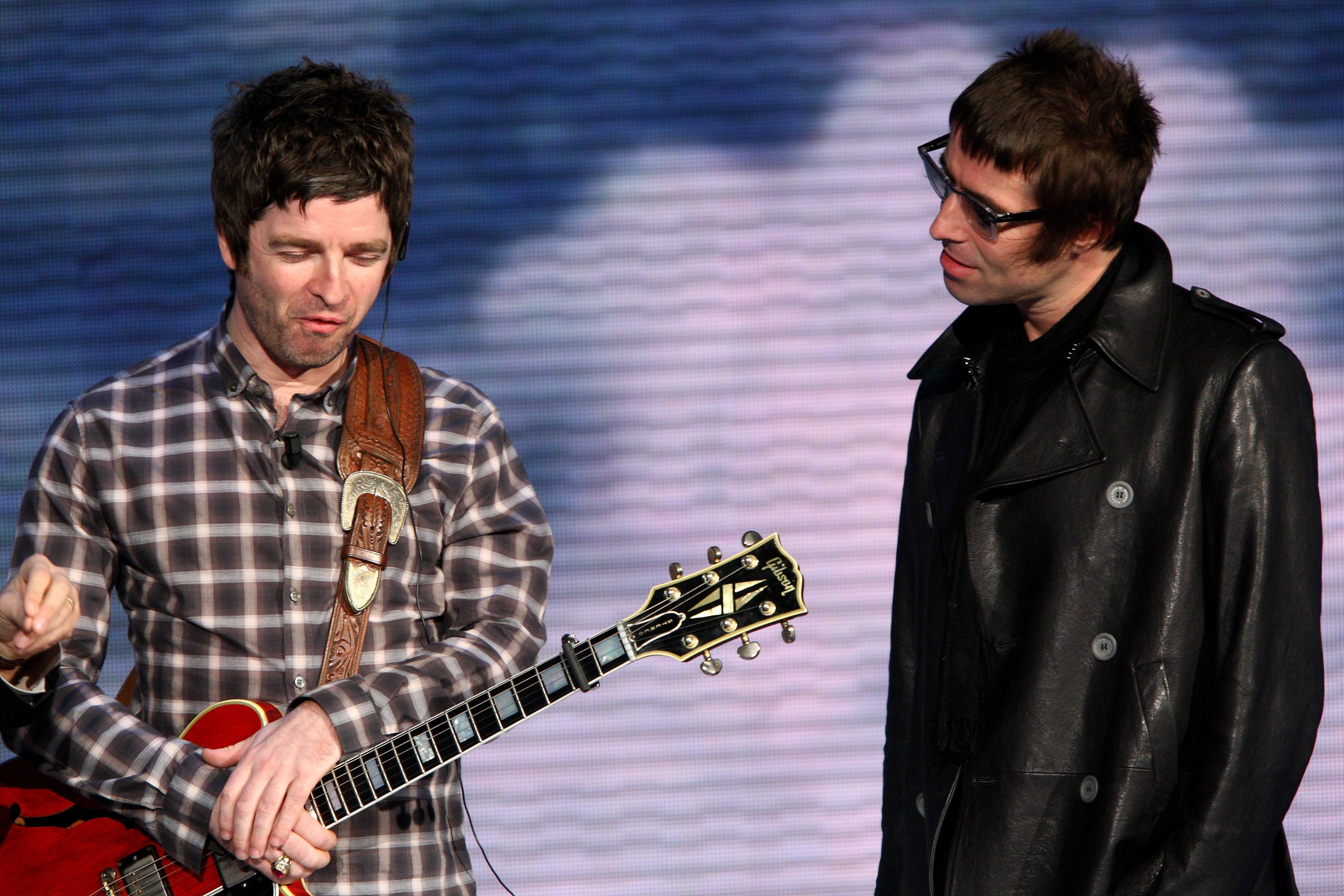 Noel and Liam Gallagher on stage together in 2008