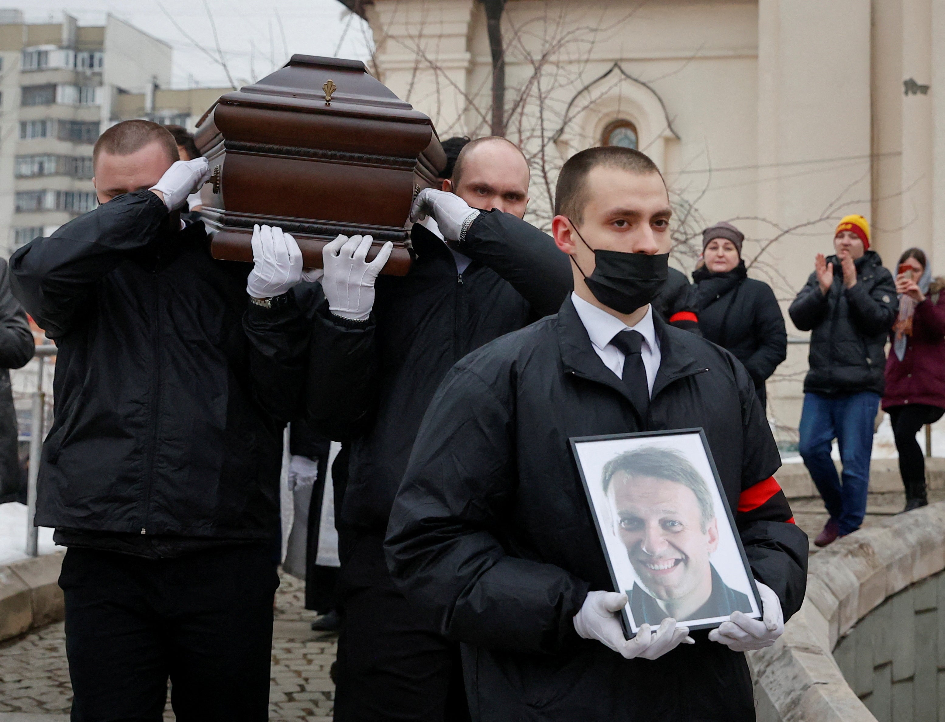 Navalny’s coffin is carried out of the church