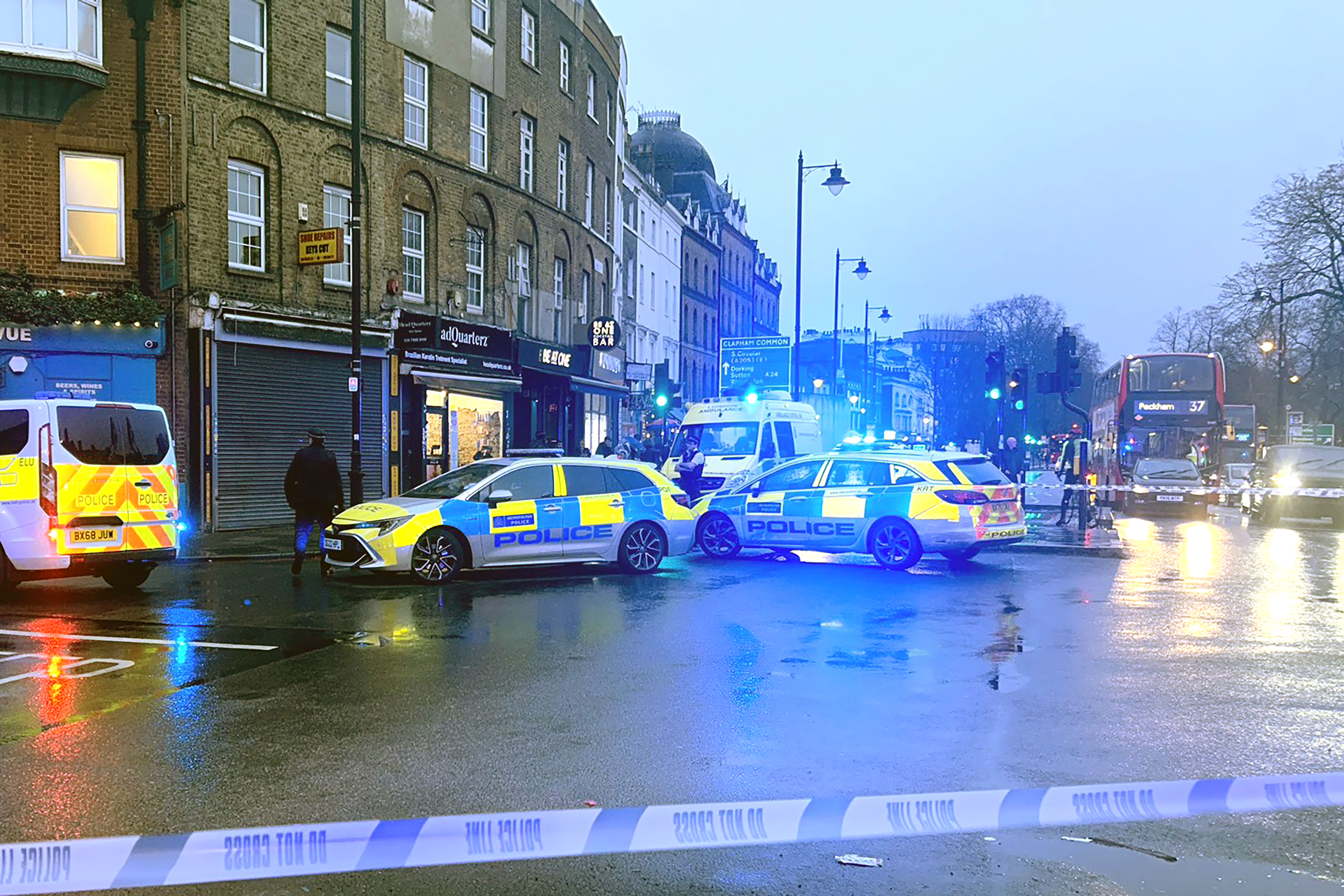 Police at the scene of the shooting in Clapham, London (Rachel Williamson/PA)