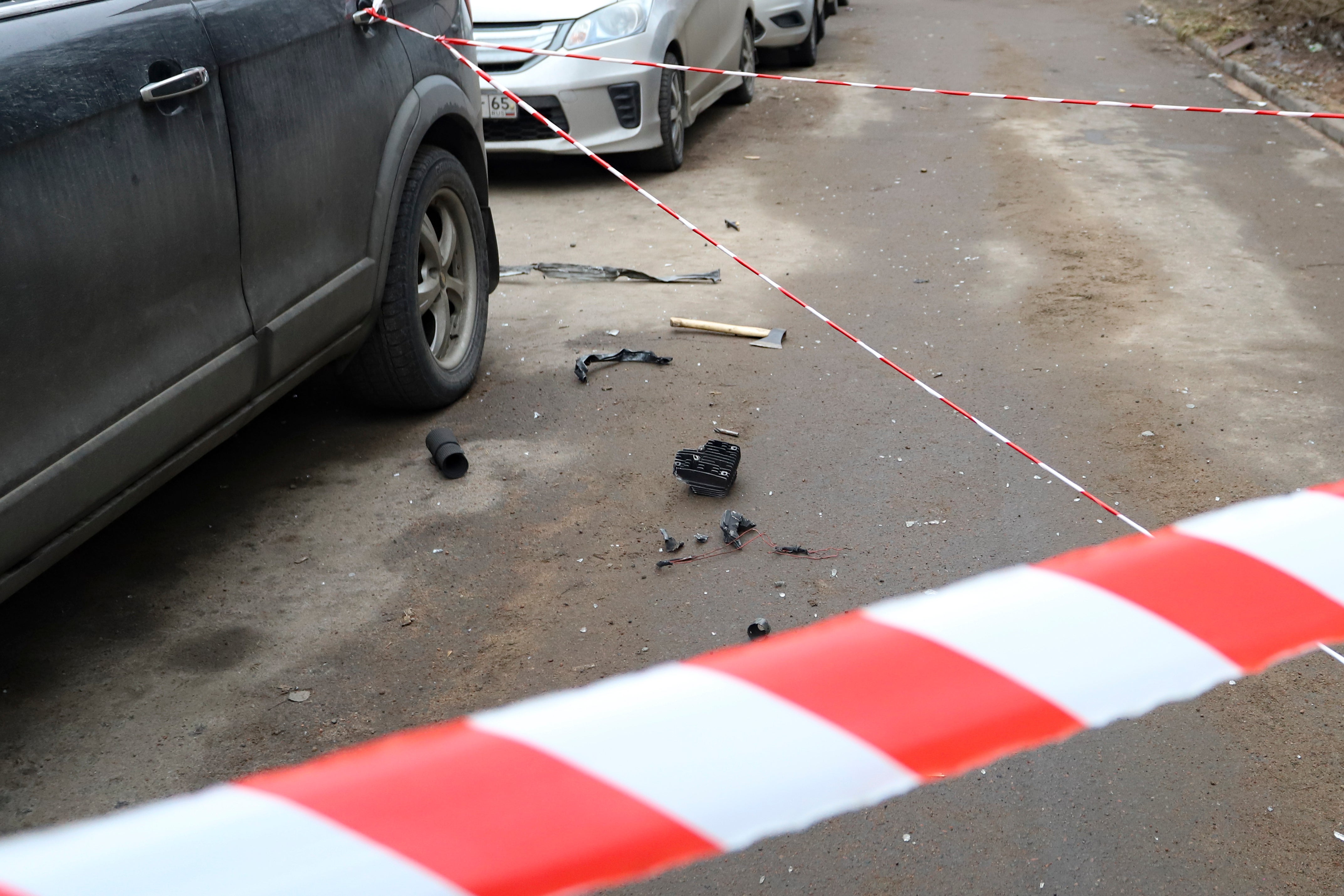 The wreckage of a drone near a damaged apartment's building after a reported drone attack in St Petersburg