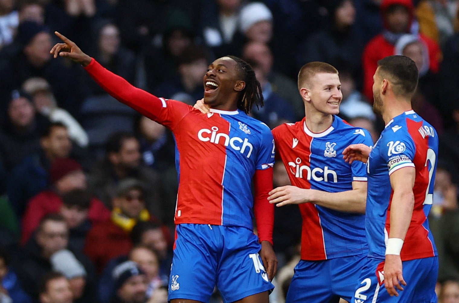 Eberechi Eze celebrates scoring their first goal with Adam Wharton and Joel Ward