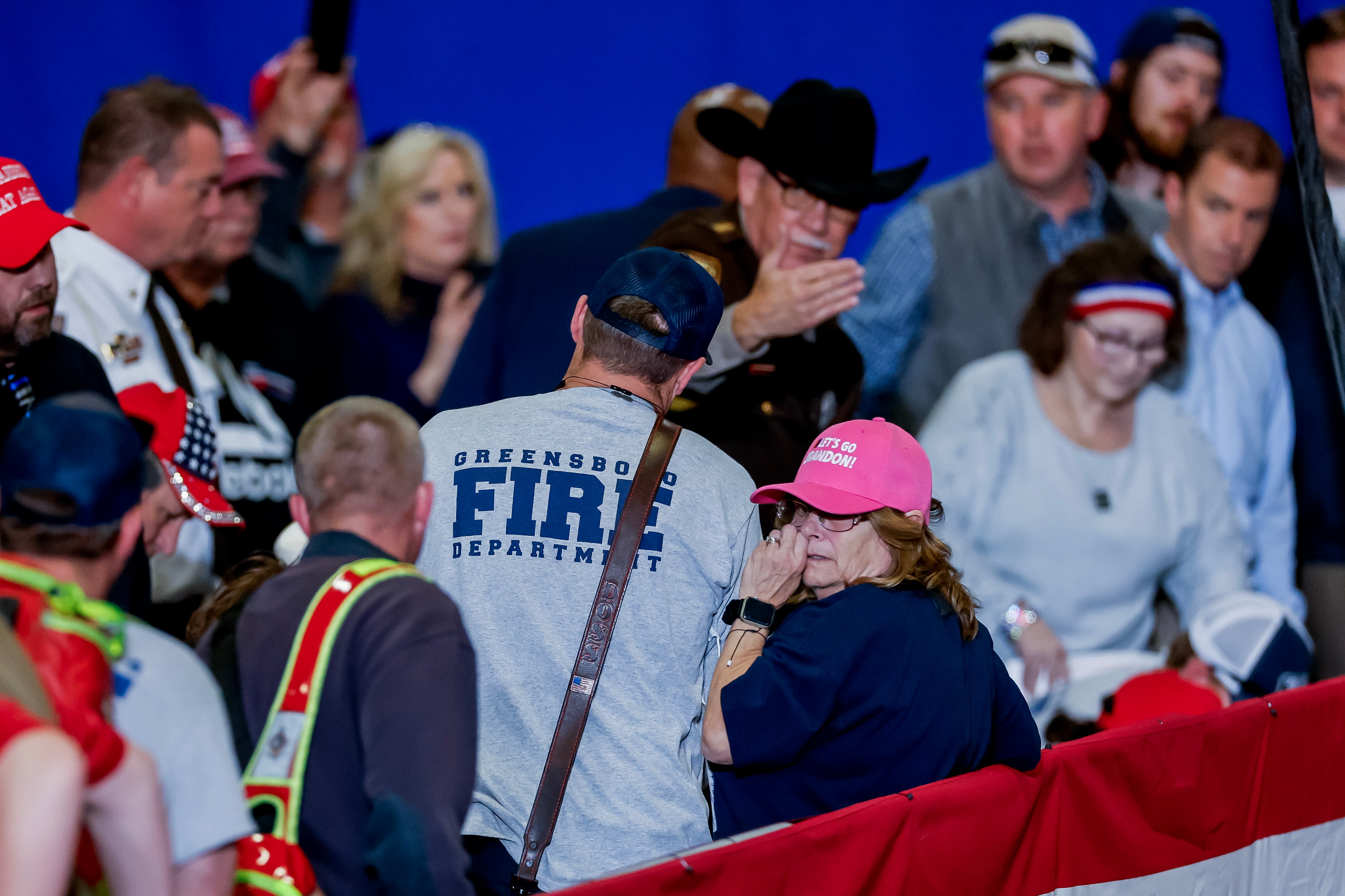 Emergency personnel respond as an attendee falls ill as former US President and Republican presidential candidate Donald Trump participates in a ‘Get Out The Vote Rally’ campaign event at the Greensboro Coliseum Complex in Greensboro, North Carolina