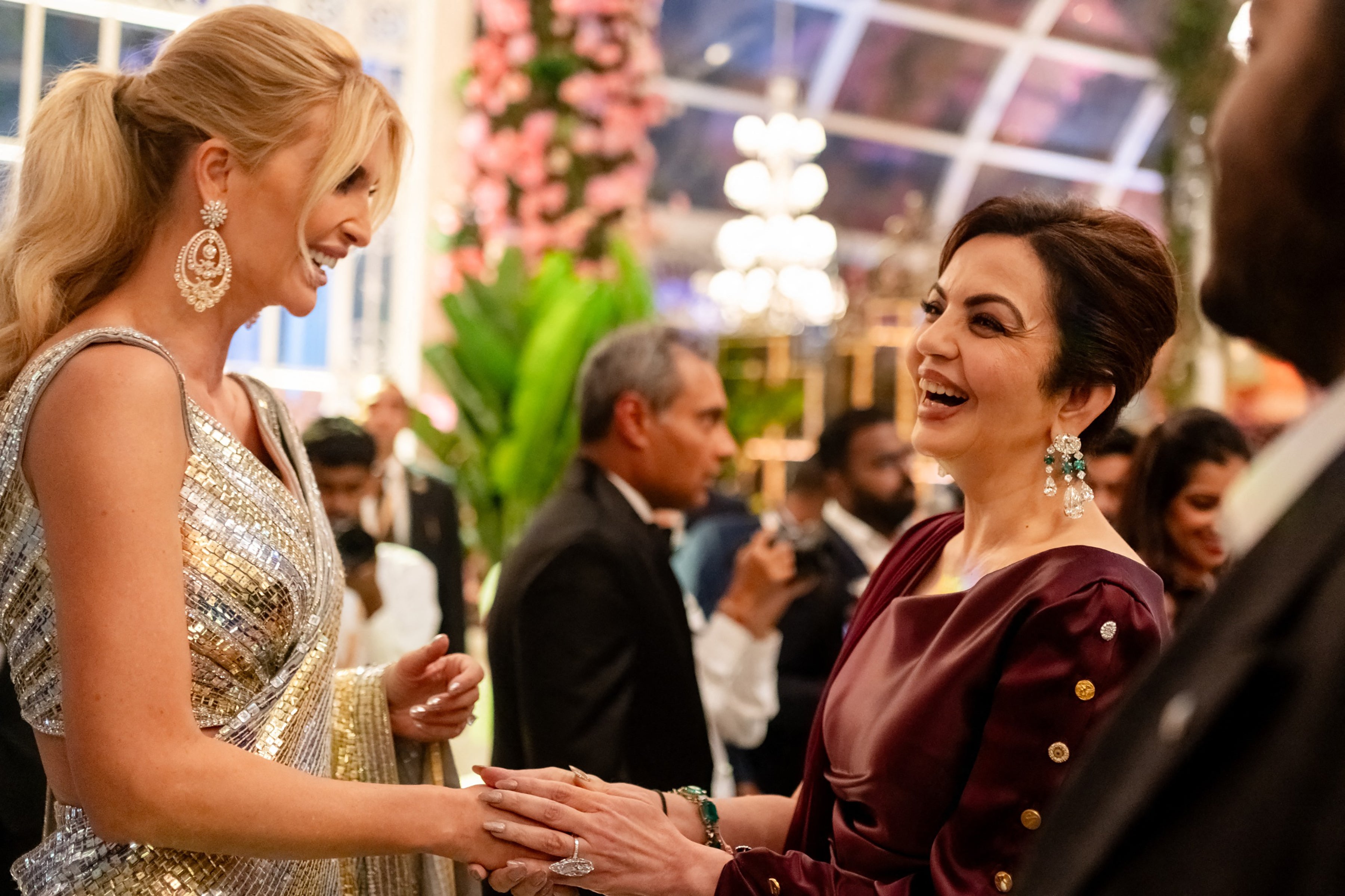 Chairperson and founder of the Reliance Foundation Nita Ambani (R), wife of billionaire tycoon Mukesh Ambani speaking to Ivanka Trump (L),