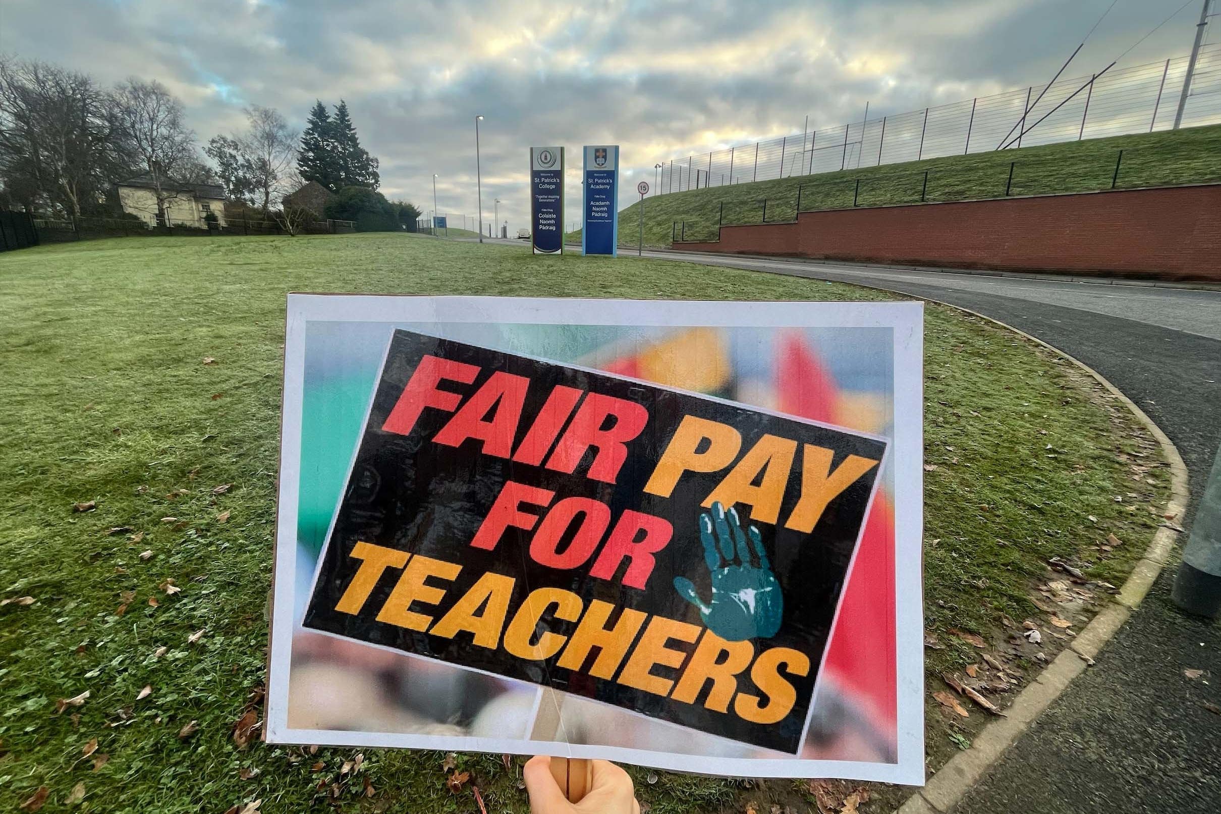 Signage on the picket line during a protest for teacher pay (Claudia Savage/PA)