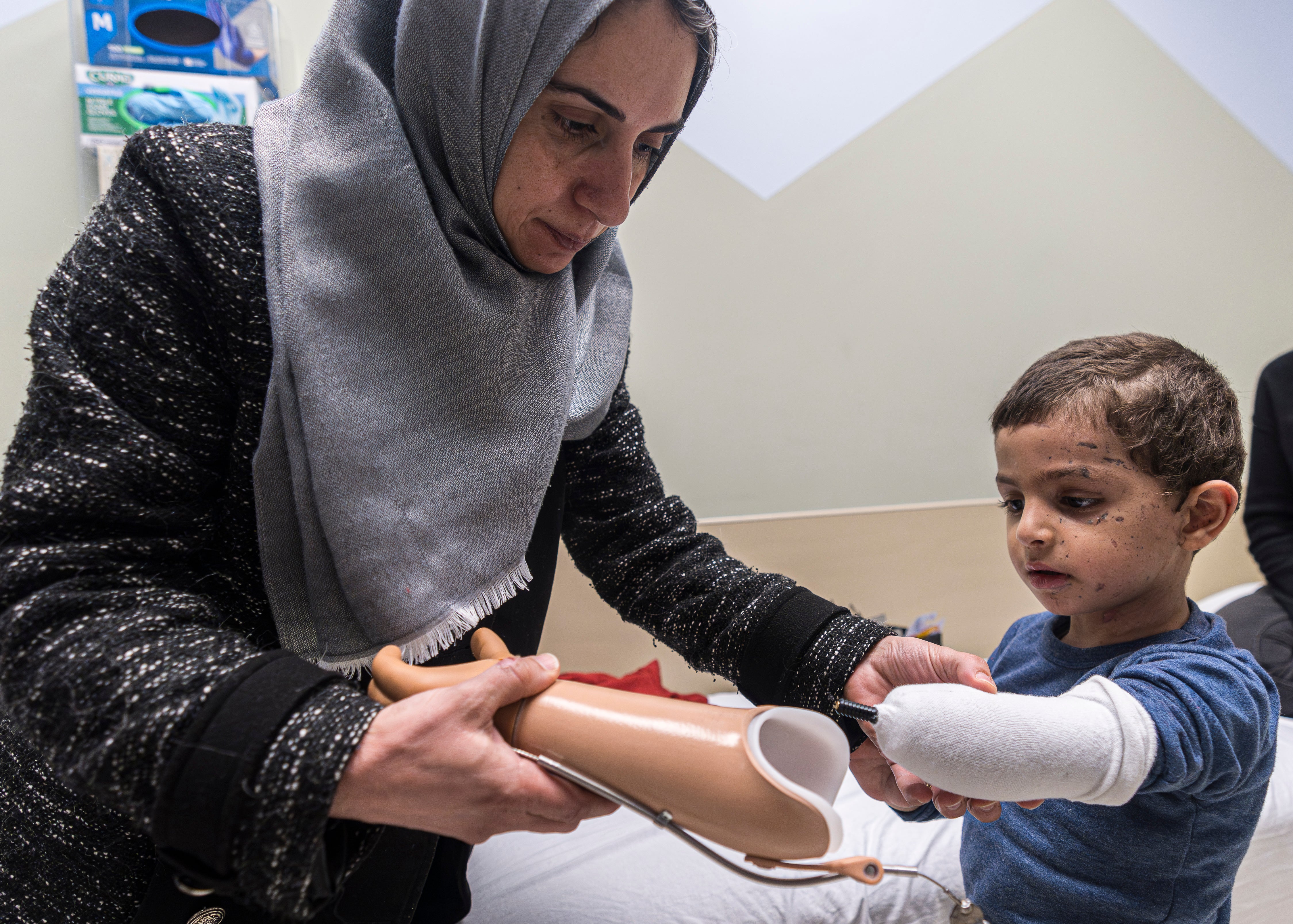 Four-year-old Omar Abu Kuwaik was taken from Gaza to the US to have a prosthetic arm fitted