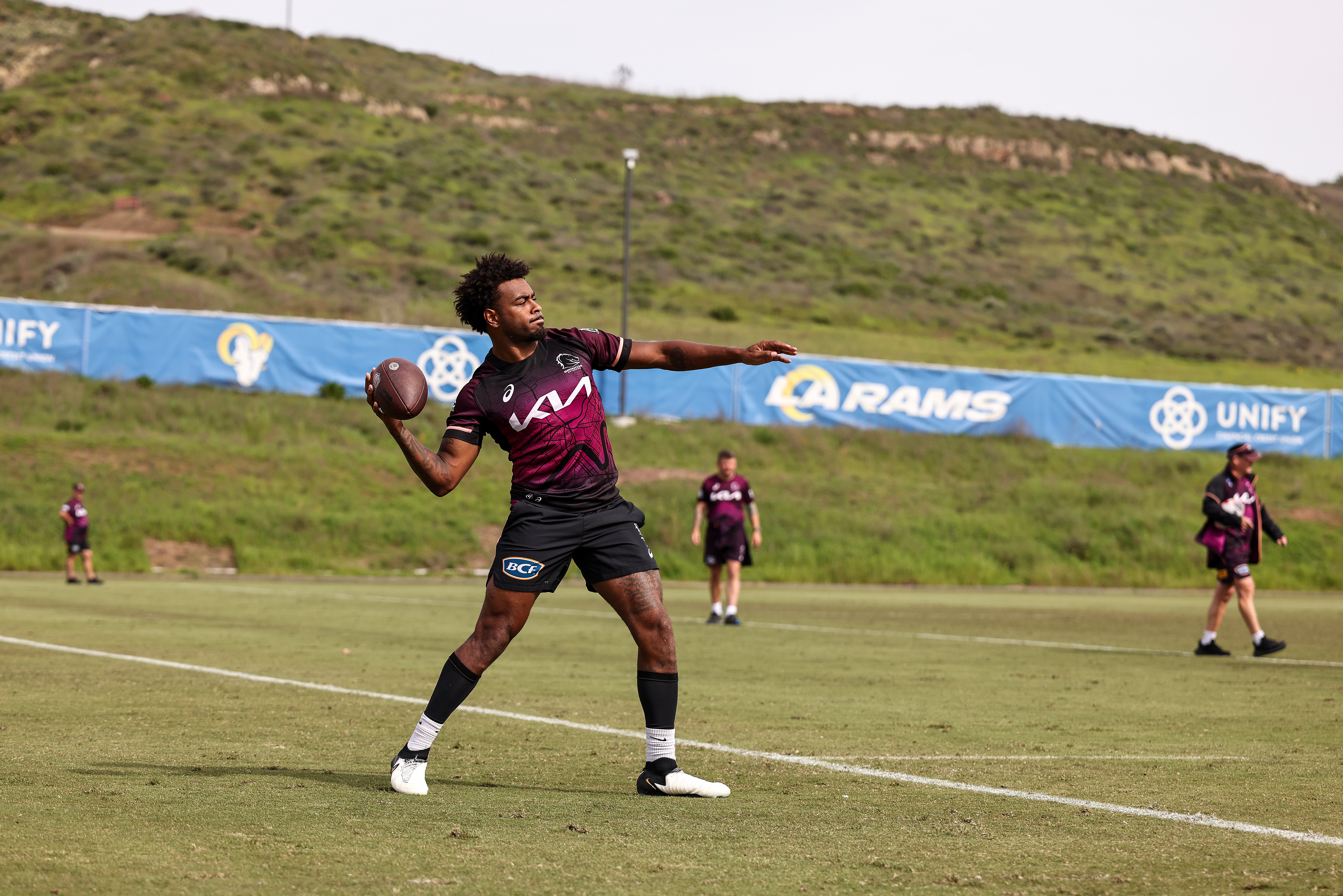 Ezra Mam throws a football during a Brisbane Broncos NRL training session at California Lutheran University