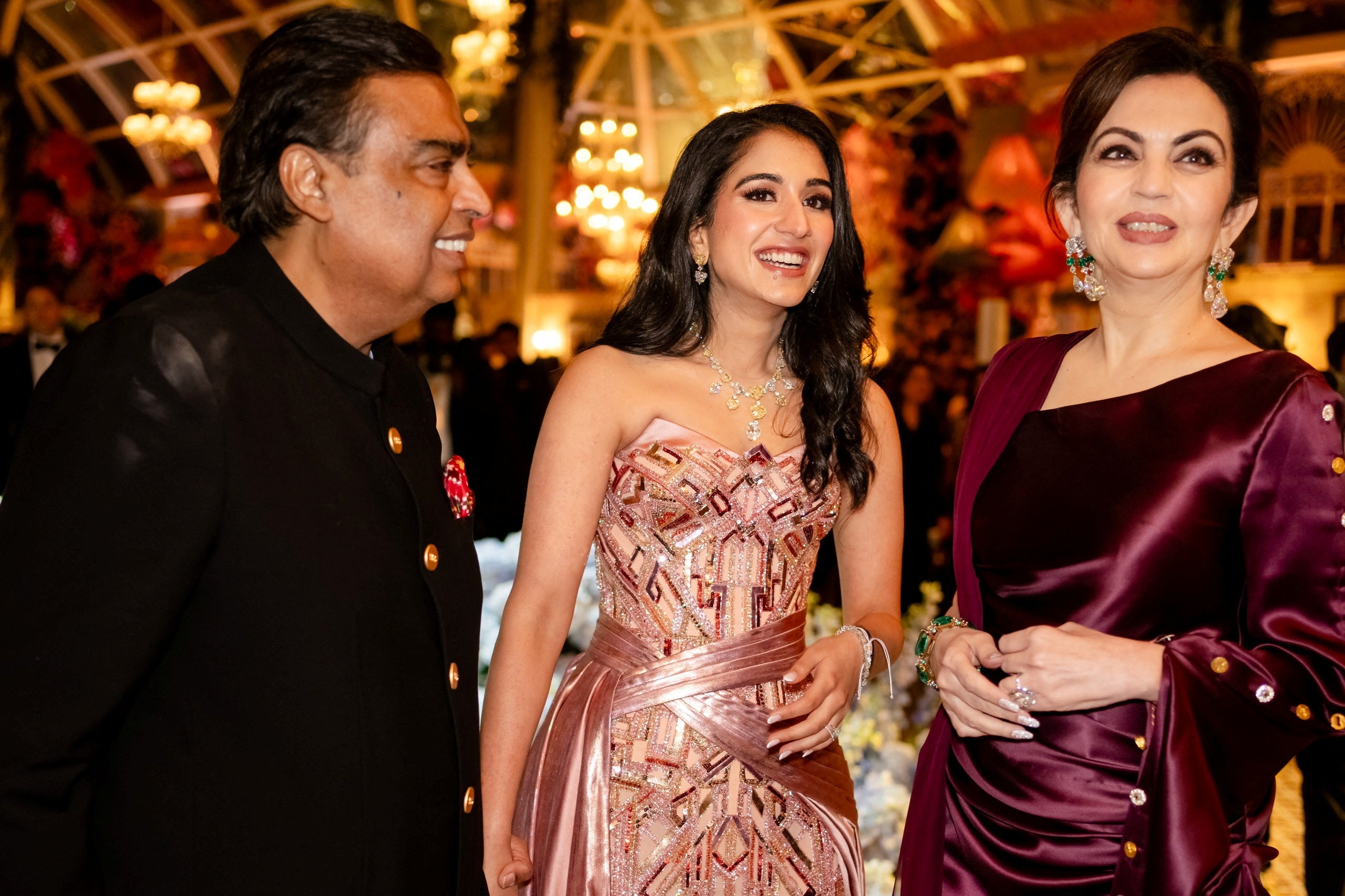 Mukesh Ambani, the Chairman of Reliance Industries, Radhika Merchant and Nita Ambani, share a moment during the pre-wedding celebrations of Anant Ambani and Radhika in Jamnagar, Gujarat, India