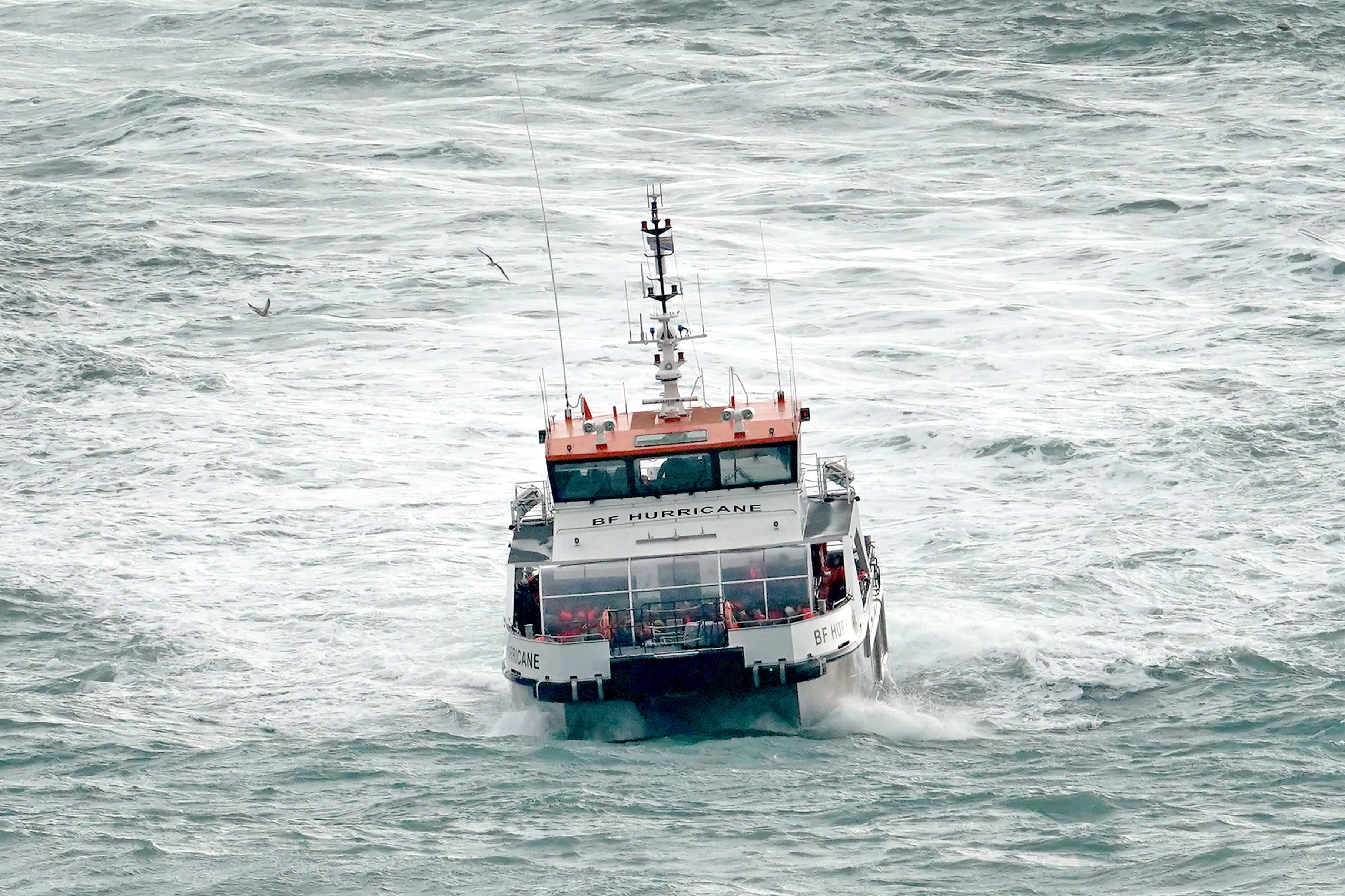 A group of people thought to be migrants are brought in to Dover, Kent, by a Border Force vessel (Gareth Fuller/PA)