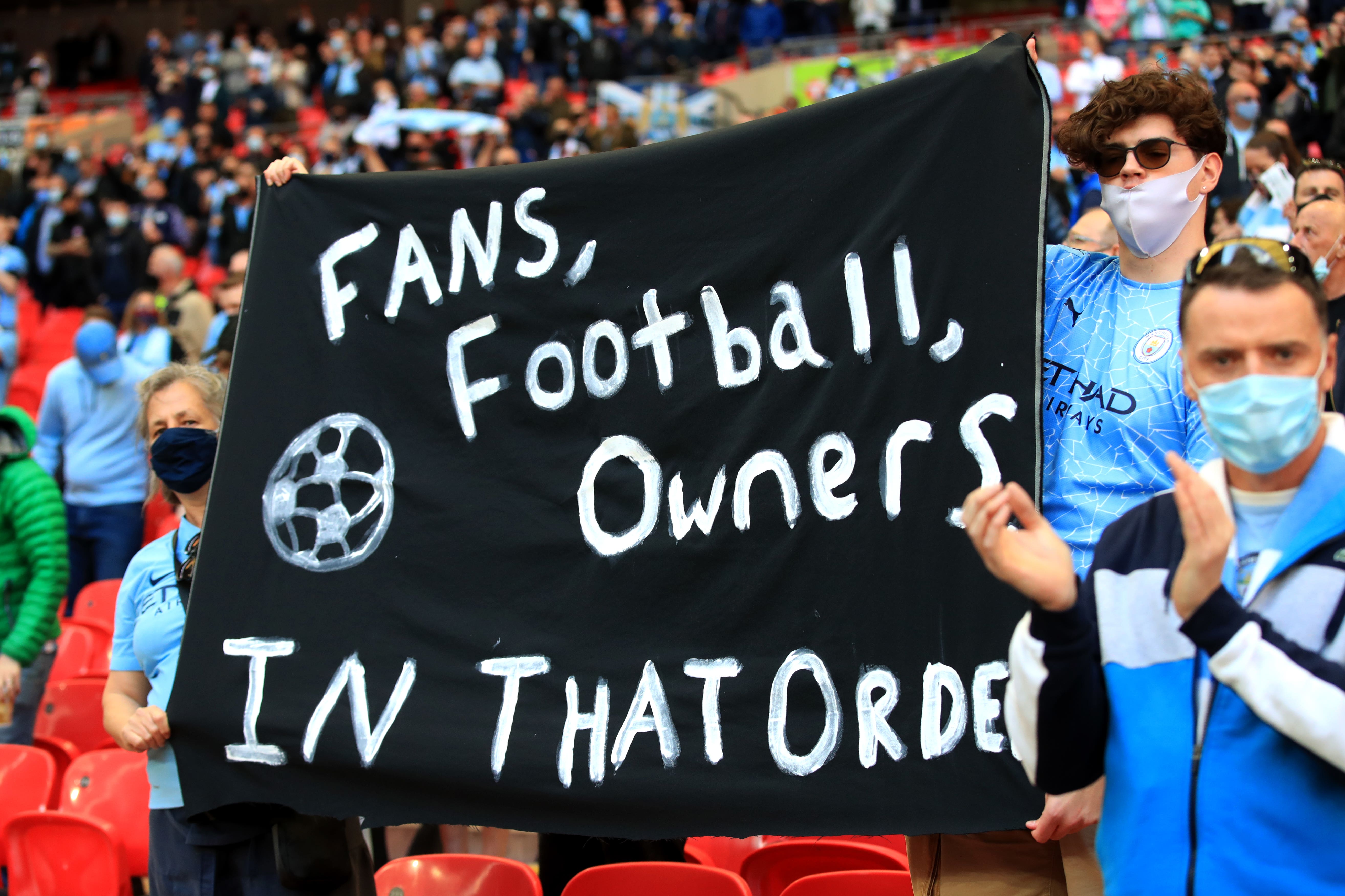 Supporters hold up a banner opposing the original Super League plans in 2021 (Adam Davy/PA)