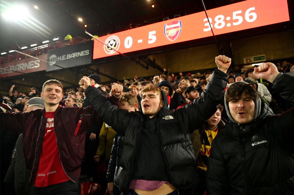 Arsenal fans celebrate at Bramall Lane