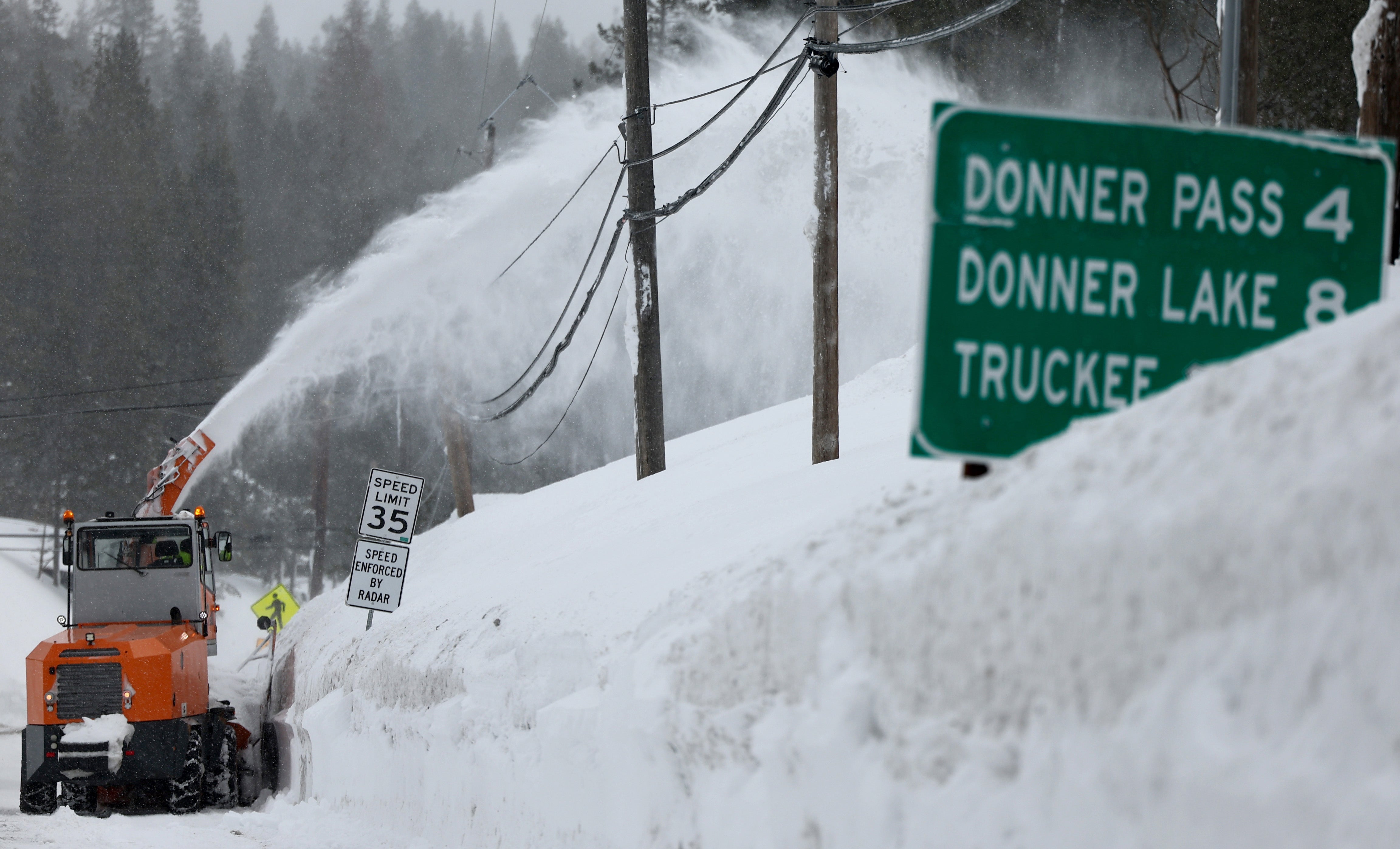 A snow blower operates following a massive snowstorm in the Sierra Nevada mountains on March 04, 2024 in Soda Springs, California