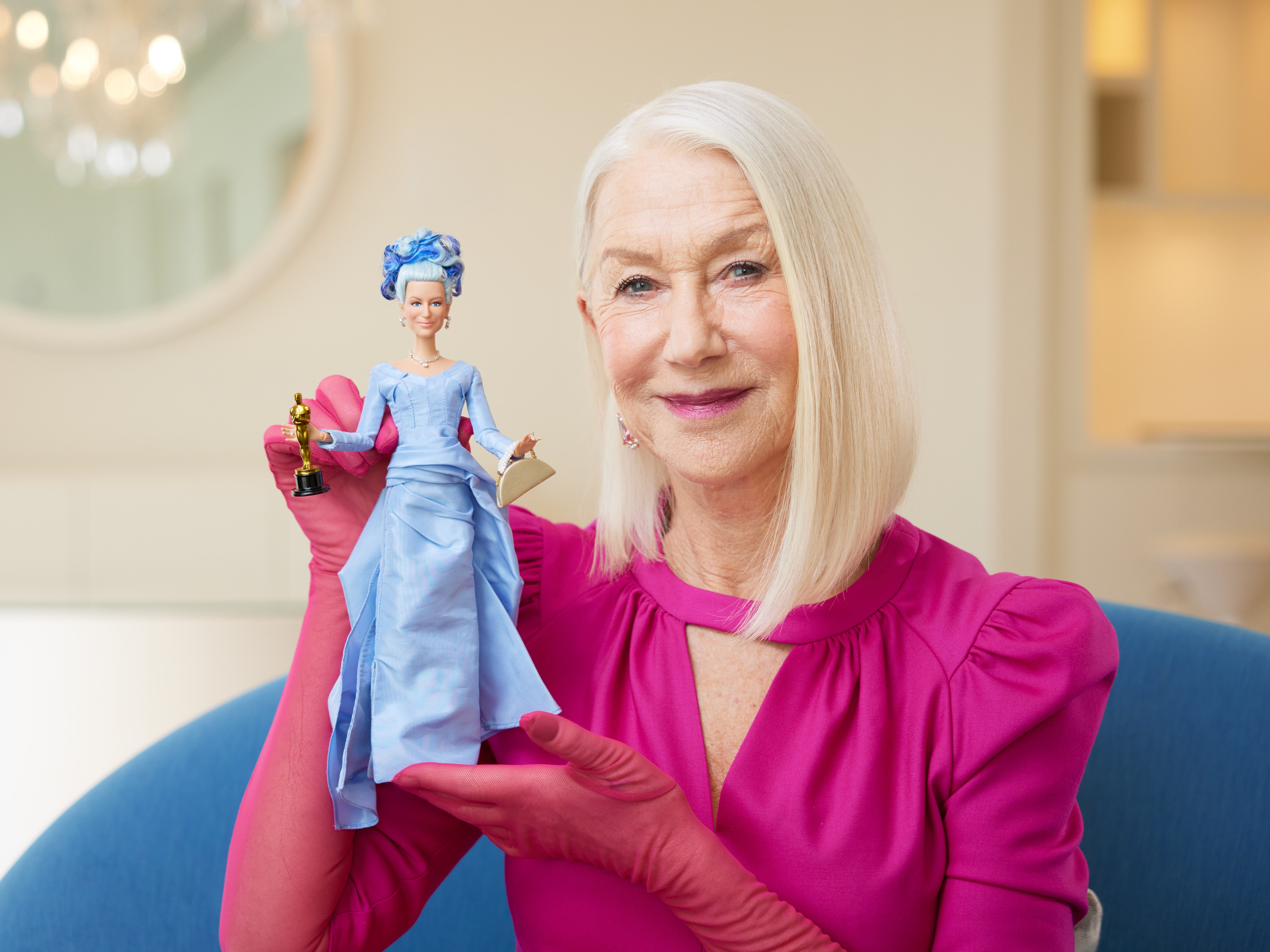 Mirren can be seen carrying a blue fan and a miniature Oscars statue, in recognition of the Academy Award she won for The Queen in 2007