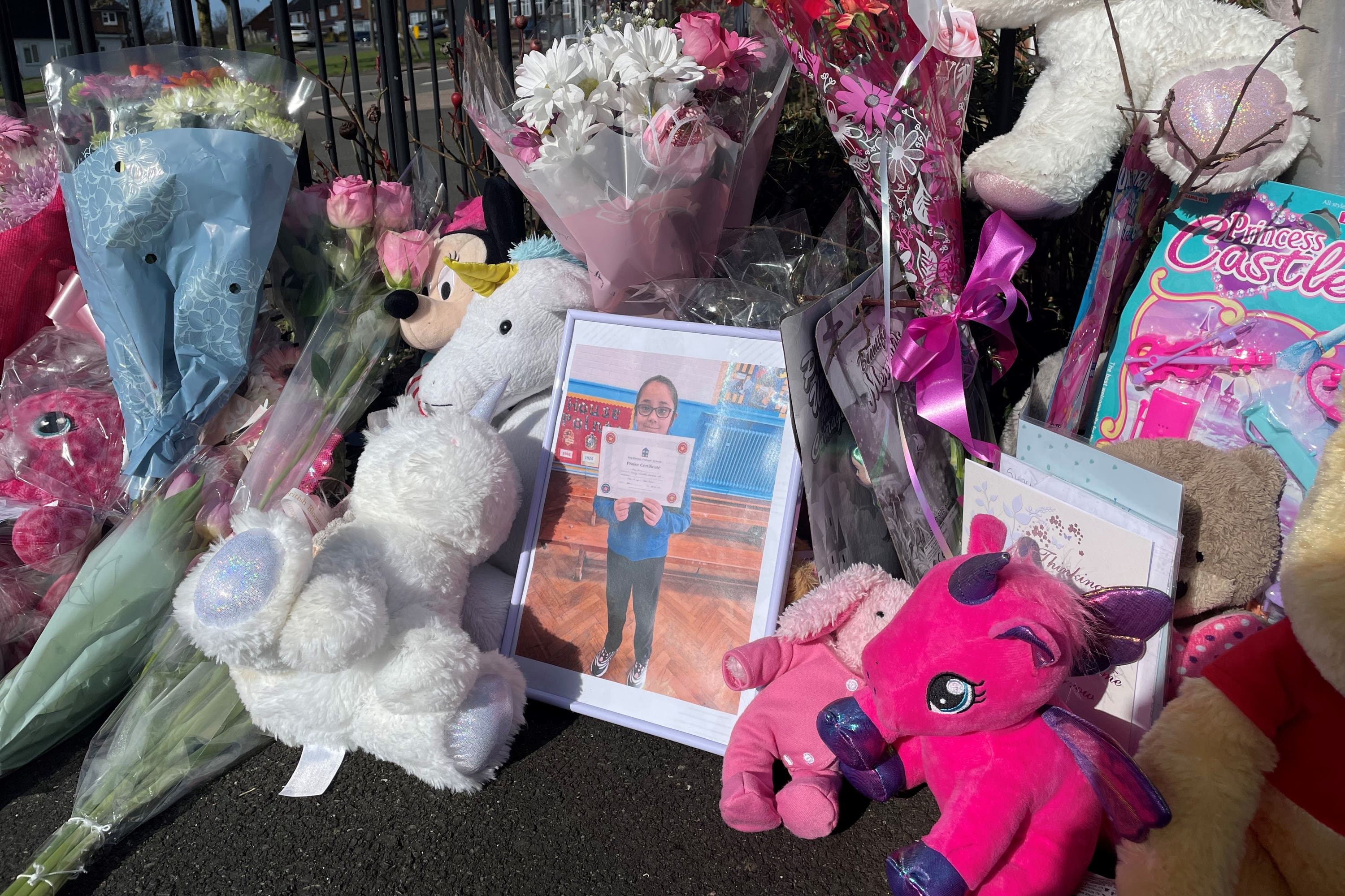 Flowers and toys left near the home of 10-year-old Shay Kang (Matthew Cooper/PA)