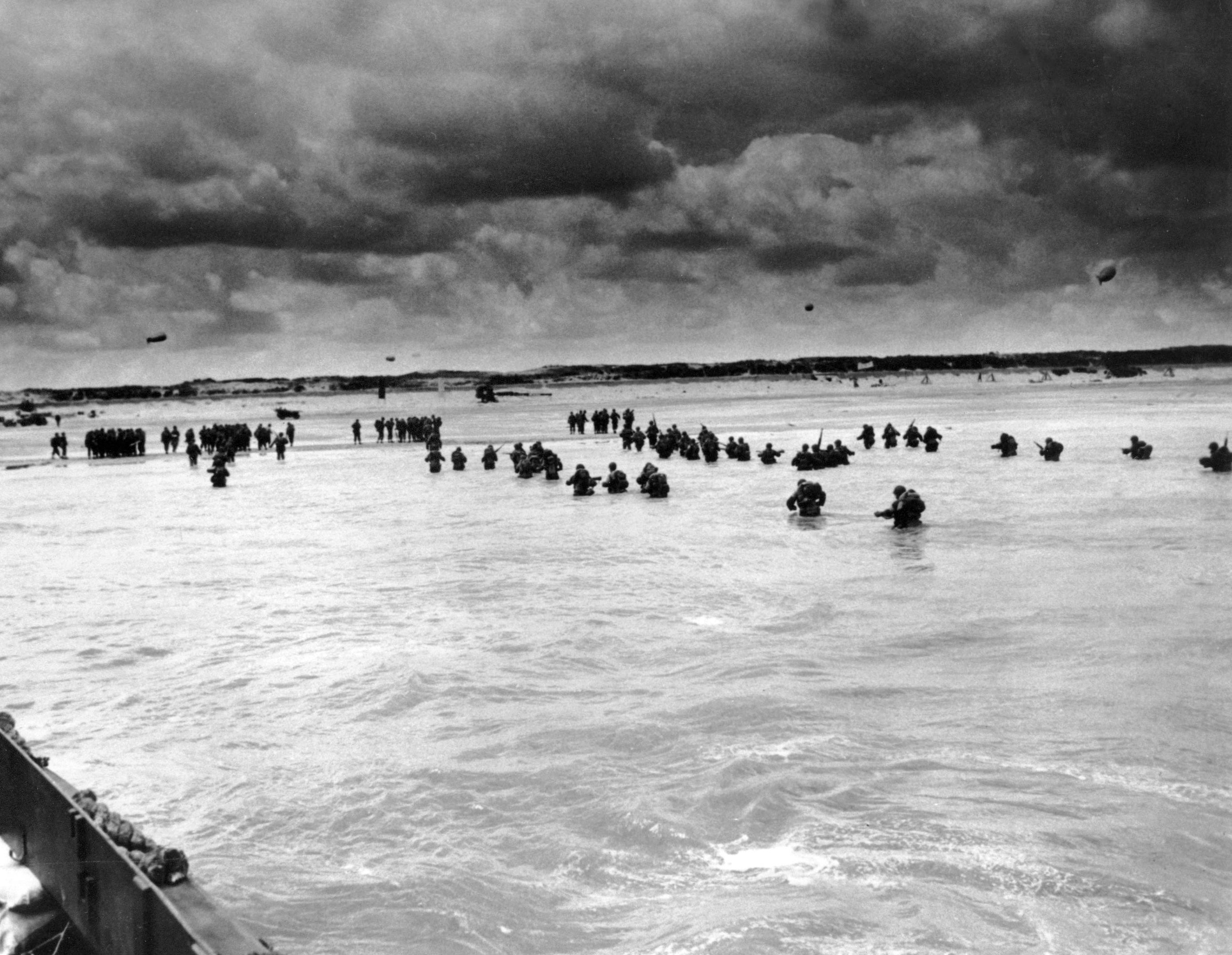 US reinforcements wade through the surf as they land at Normandy in the days following the Allies’, D-Dayinvasion