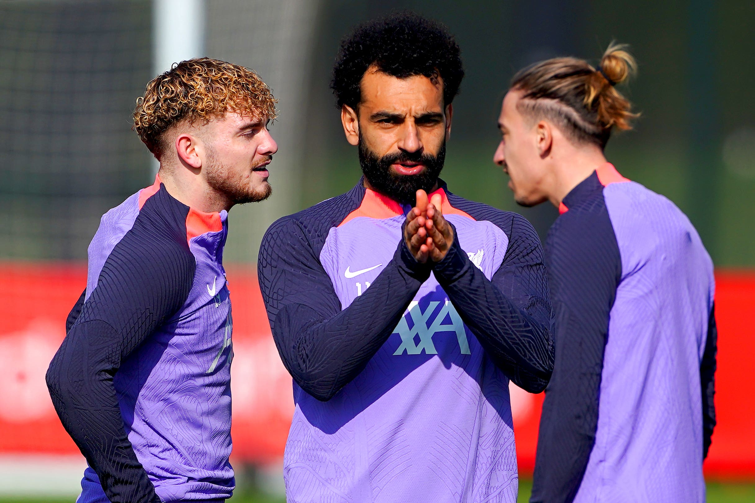 Liverpool’s Harvey Elliott, left, Mohamed Salah, centre, and Kostas Tsimikas, right, in training (Peter Byrne/PA)