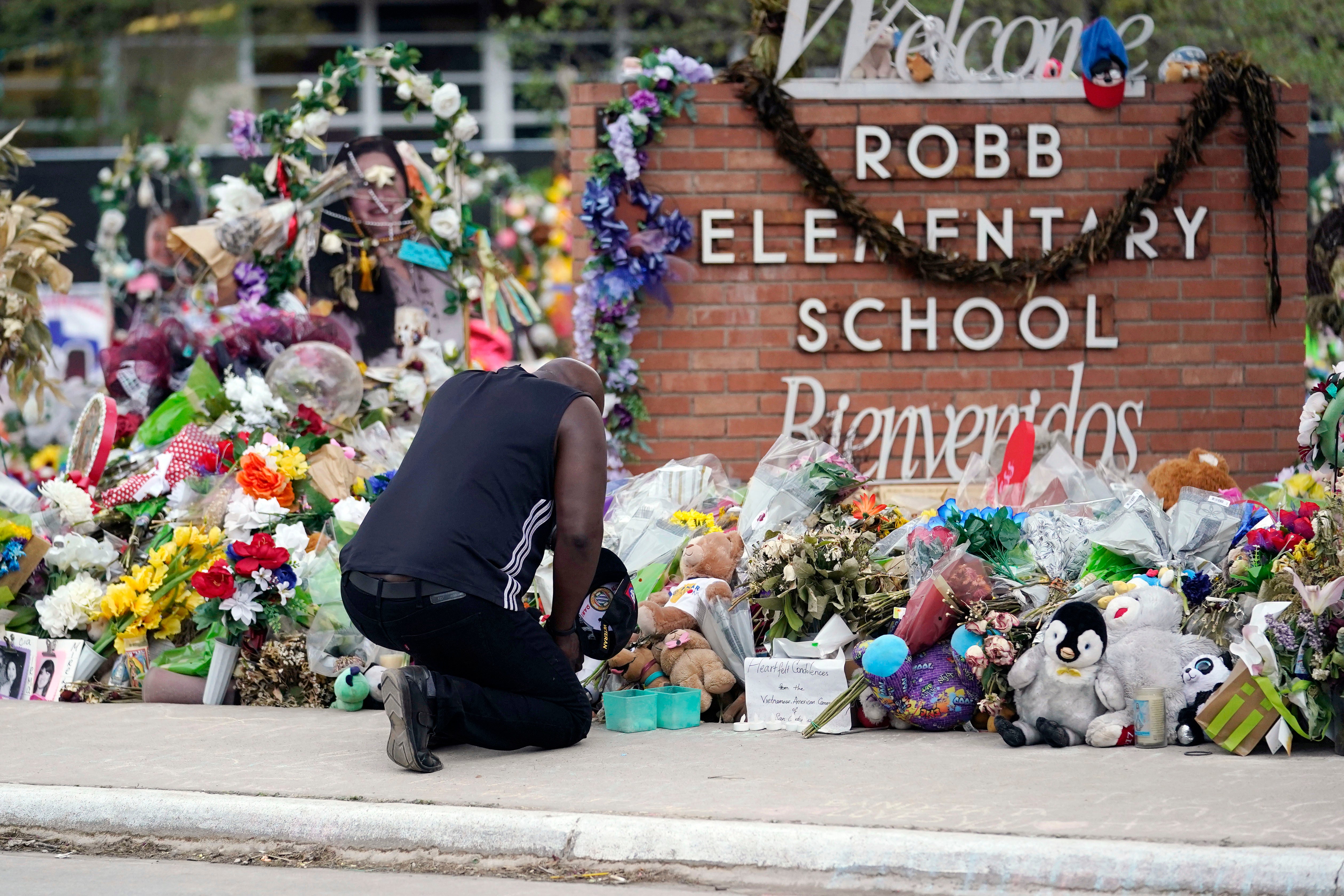 Reggie Daniels pays his respects a memorial at Robb Elementary School, June 9, 2022, in Uvalde, Texas. Uvalde agreed on 22 May, 2024 to a $2m settlement with families of the victims of the shooting