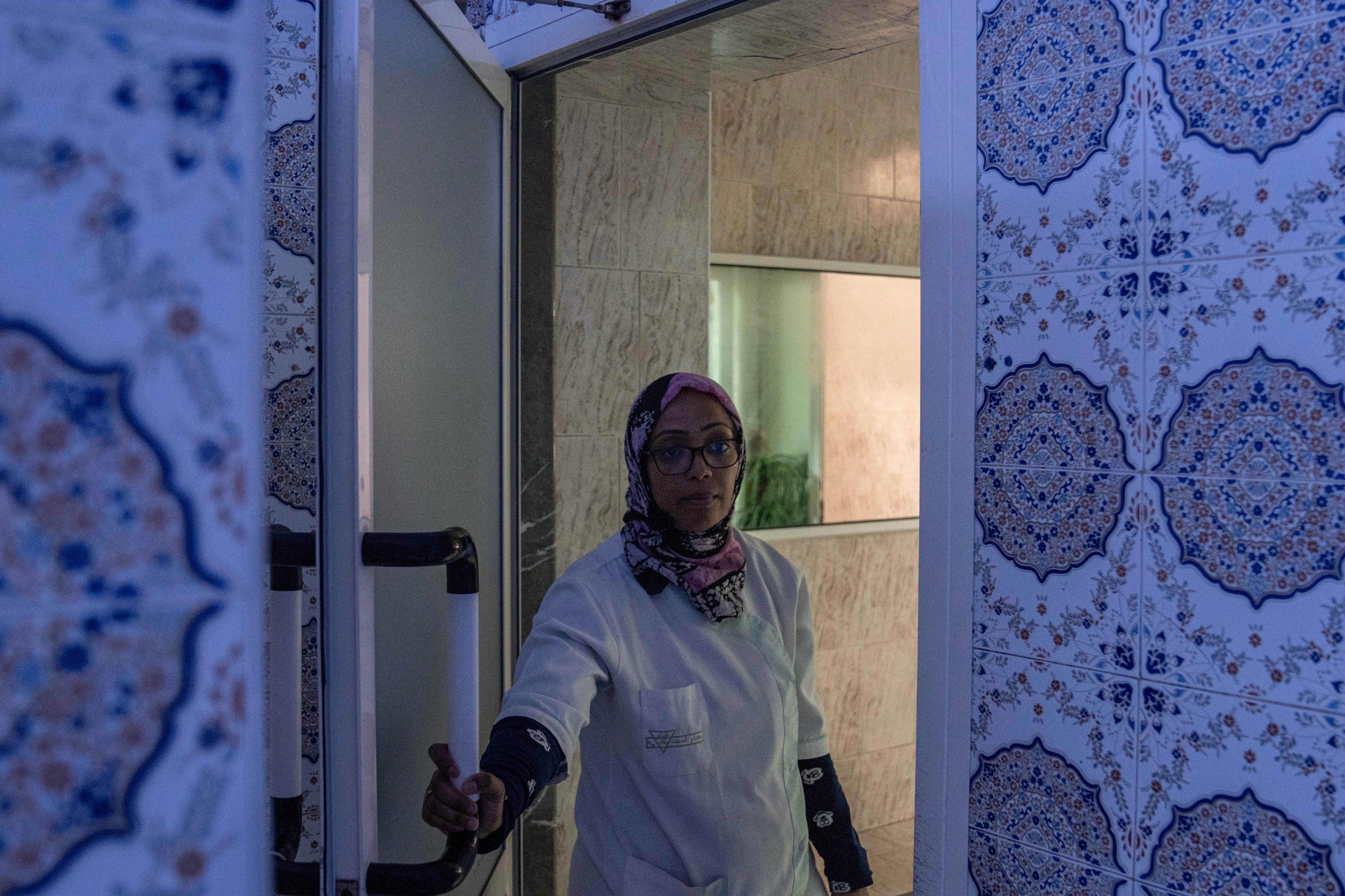 A worker at an empty Moroccan traditional bath, known as hammam, in Rabat